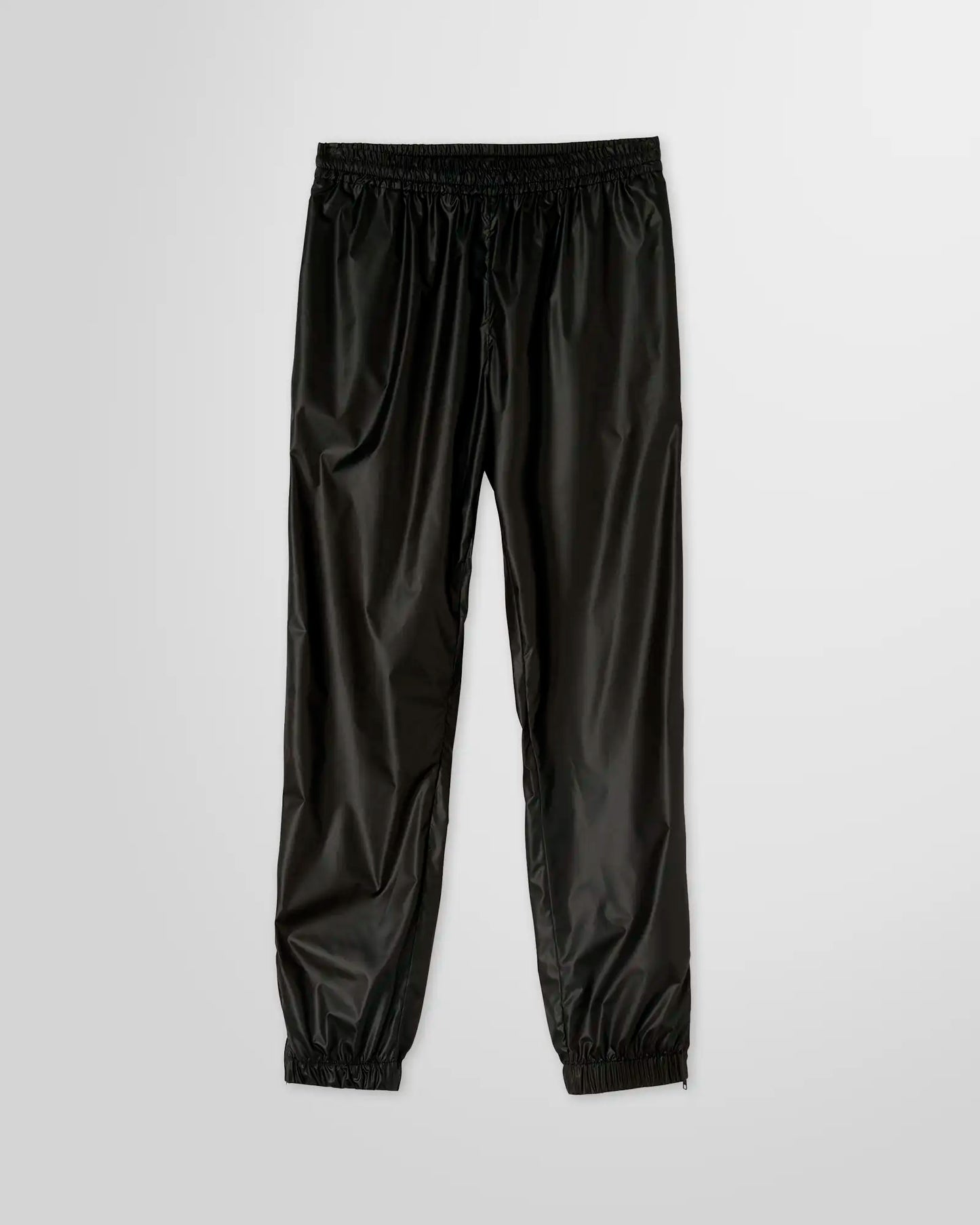 MSGM Black Nylon Track Pants with elastic waistband, side pockets, and logo patch on the rear pocket.