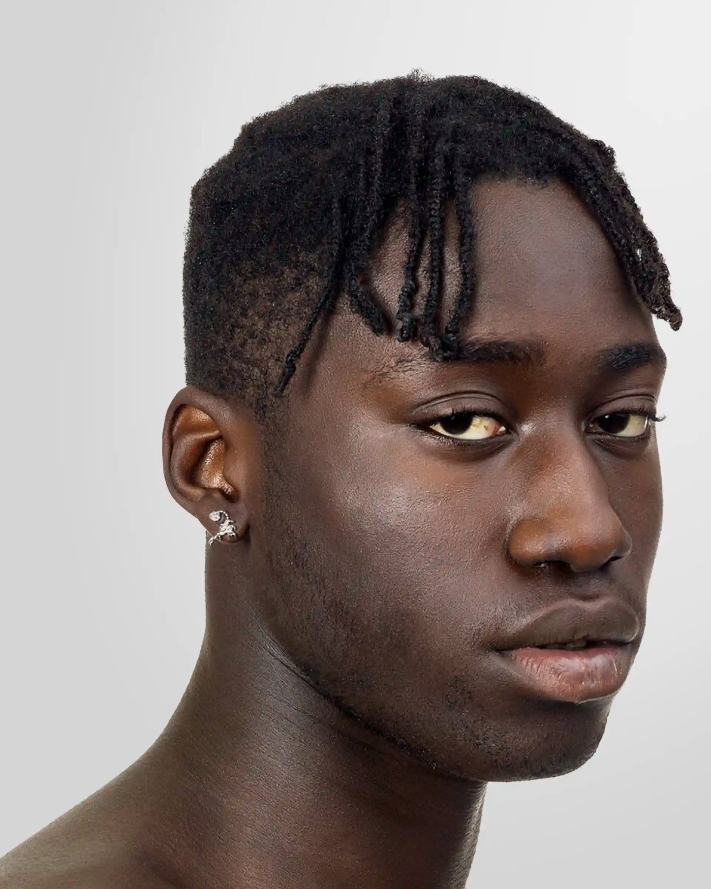 Model wearing Alan Crocetti Hybrid Stud Earring in silver with rhodium vermeil finish.