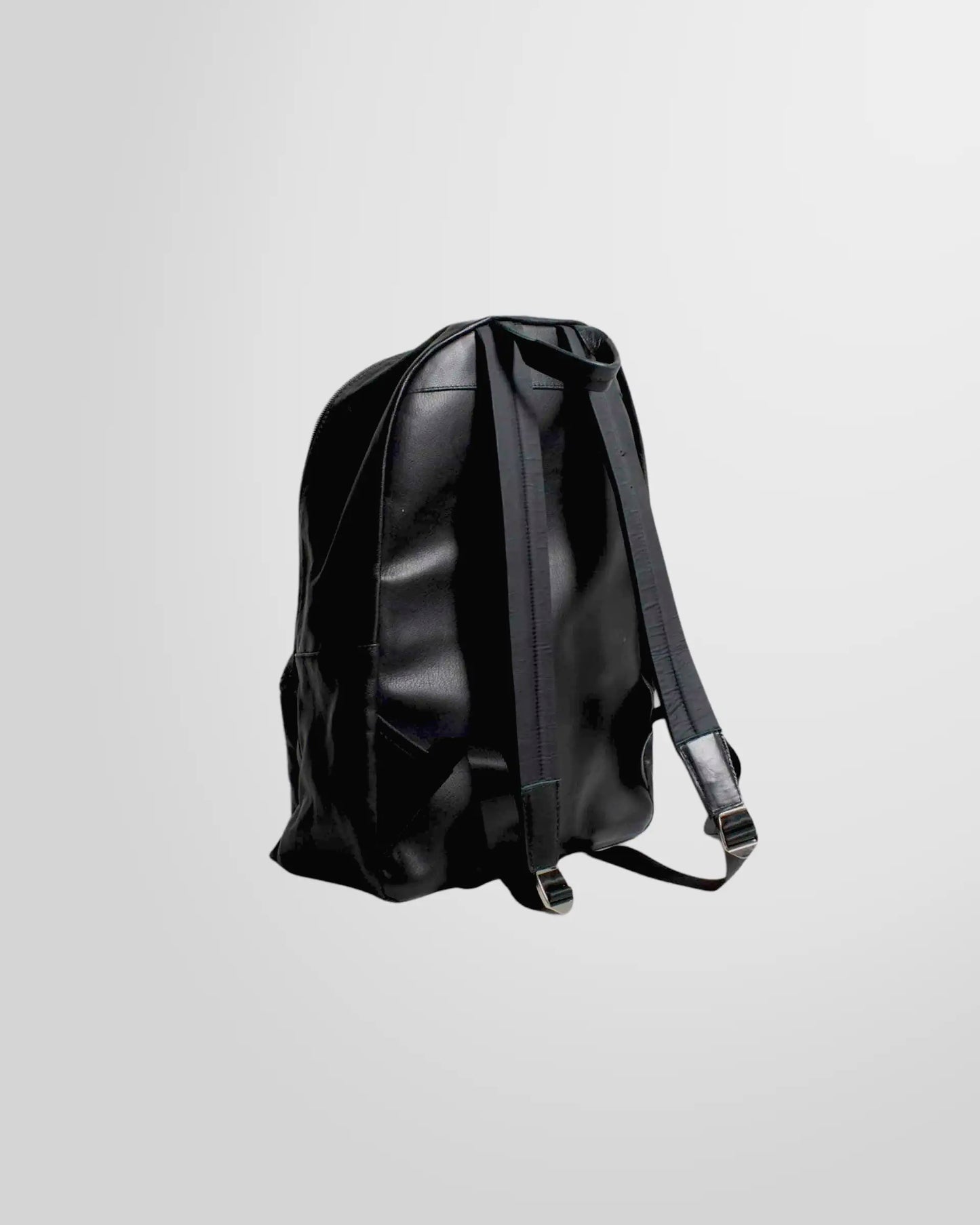 Close-up detail of the zipper and soft nappa leather texture on the Johnny Ramli backpack.