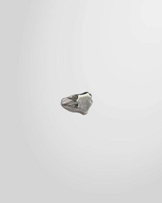 Side view of the Johnny Ramli Shield Signet Ring, showing its crest shape and oxidized face.