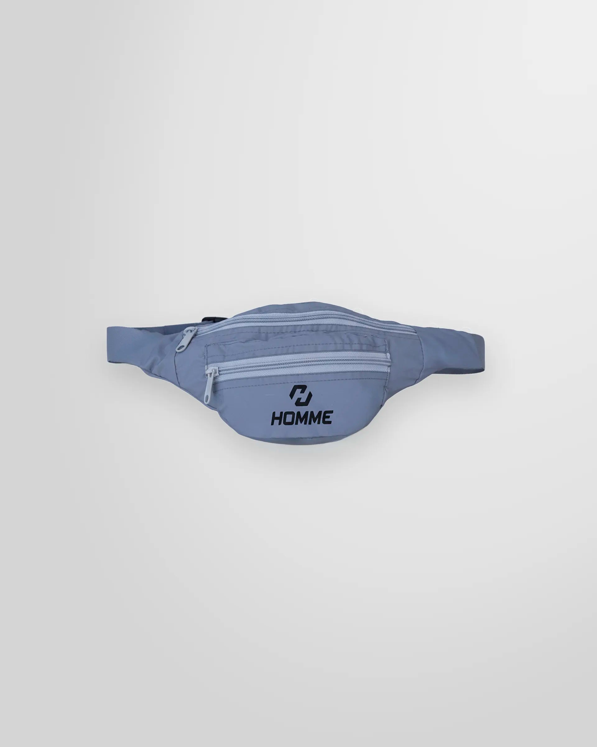 Front view of the Not Guilty Homme technical belt bag in grey, showing the external zip pockets and logo.