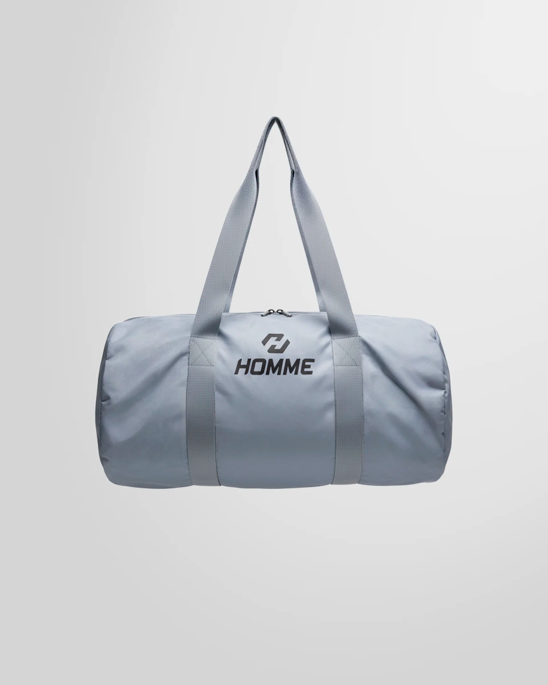 Full studio view of the Not Guilty Homme lightweight sport bag in grey, showcasing its minimalist design.