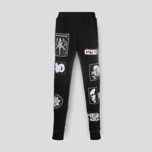 Front view of the KTZ Stitched Multi-Patch Track Pants in black, showing the collage of logo patches.
