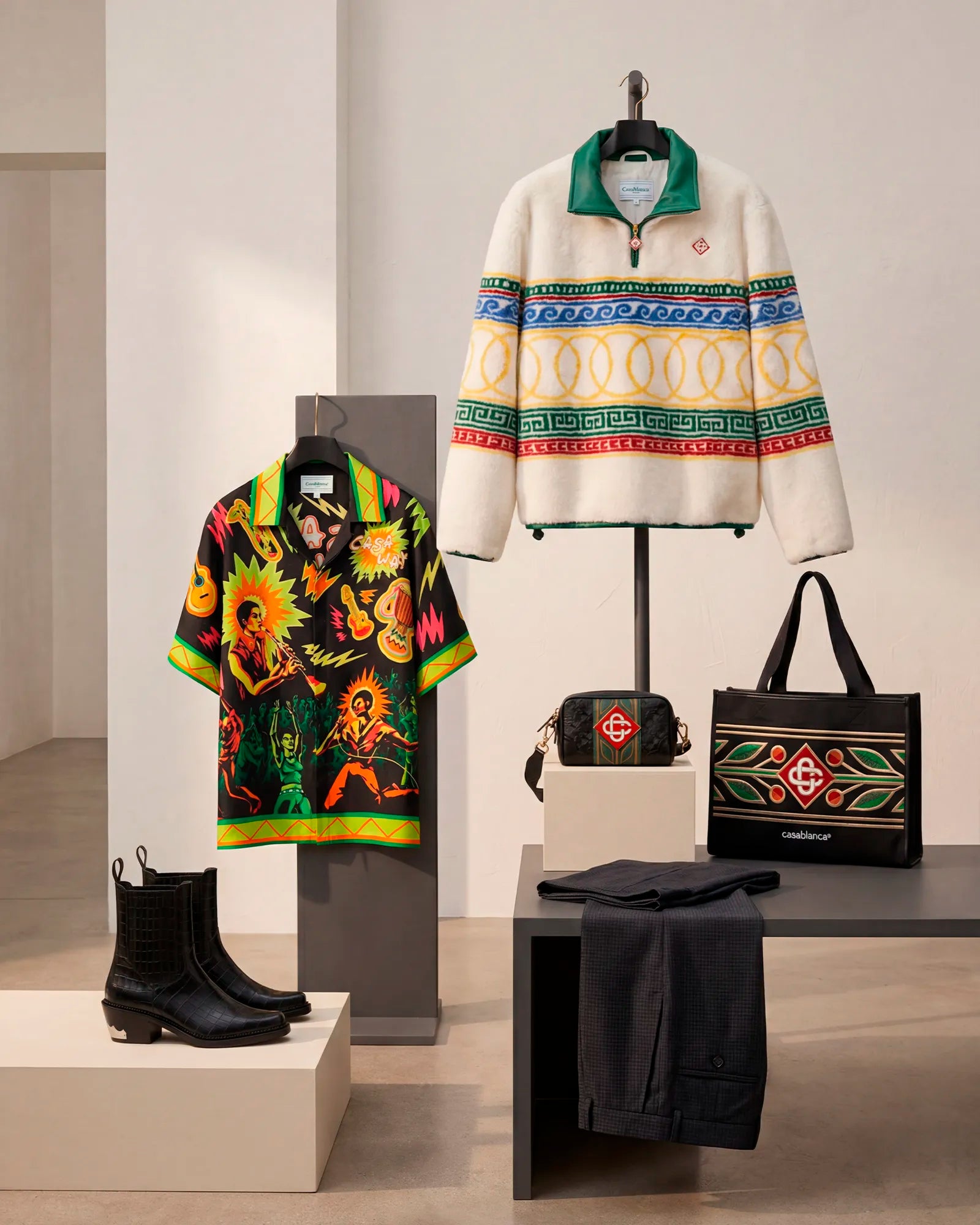 Iconic Gifts €500+ hero featuring luxury menswear curated by HOMME+.