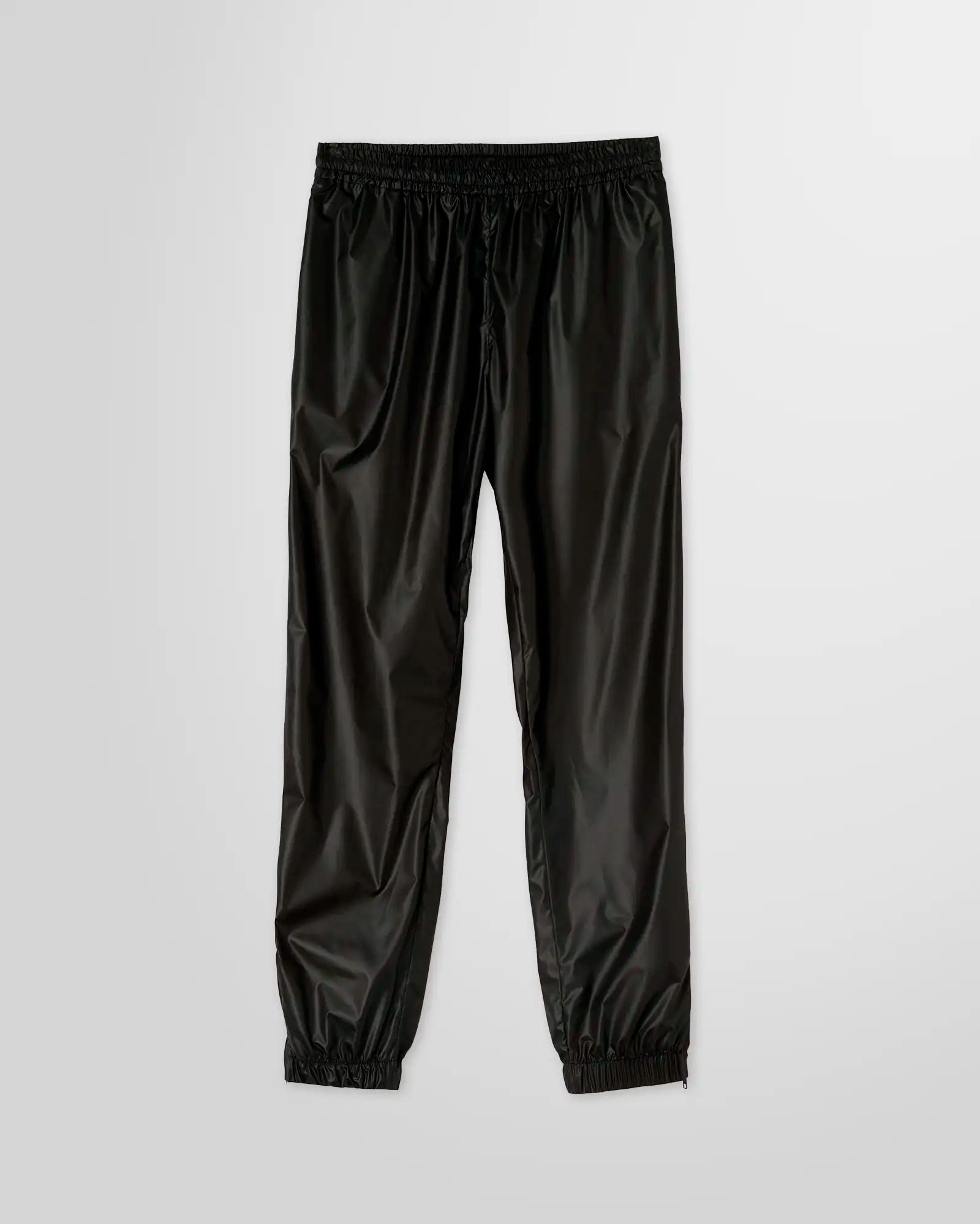 MSGM Black Nylon Track Pants with elastic waistband, side pockets, and logo patch on the rear pocket.