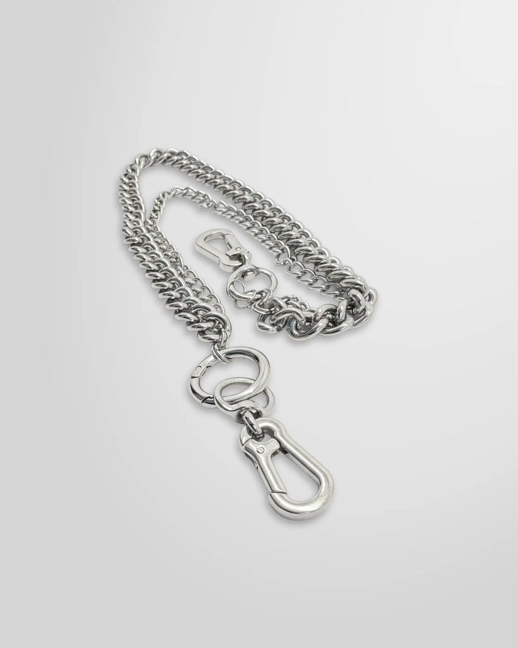 Close up view of the Not Guilty Homme layered dual curb chain accessory with two separate clasps .