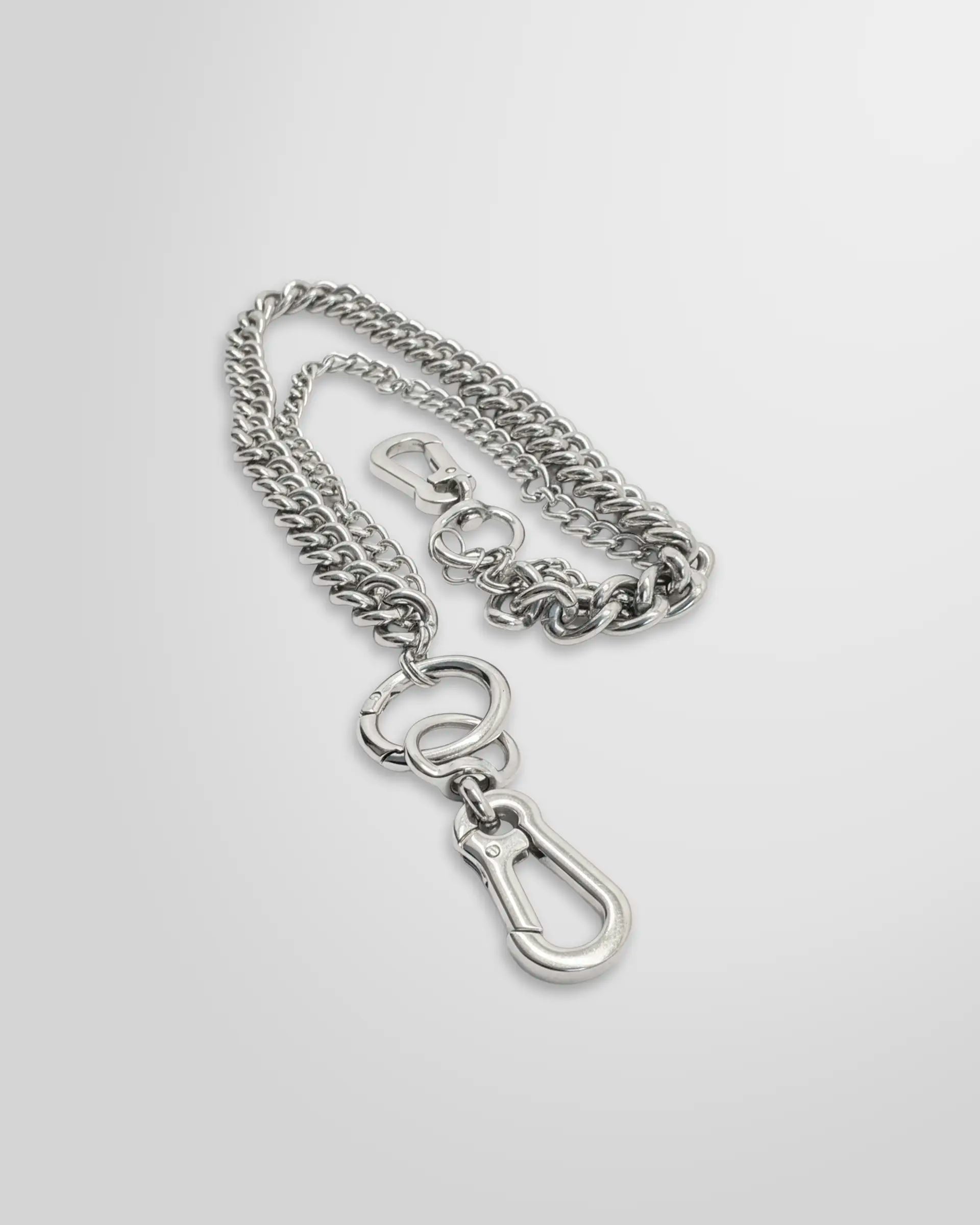 Close up view of the Not Guilty Homme layered dual curb chain accessory with two separate clasps .