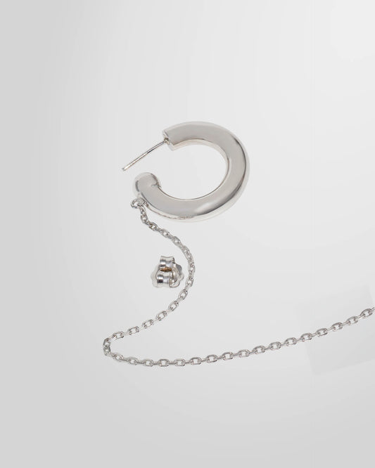 Detail of the Alan Crocetti Mood Ear Set earring highlighting the rhodium finish and chain attachment.