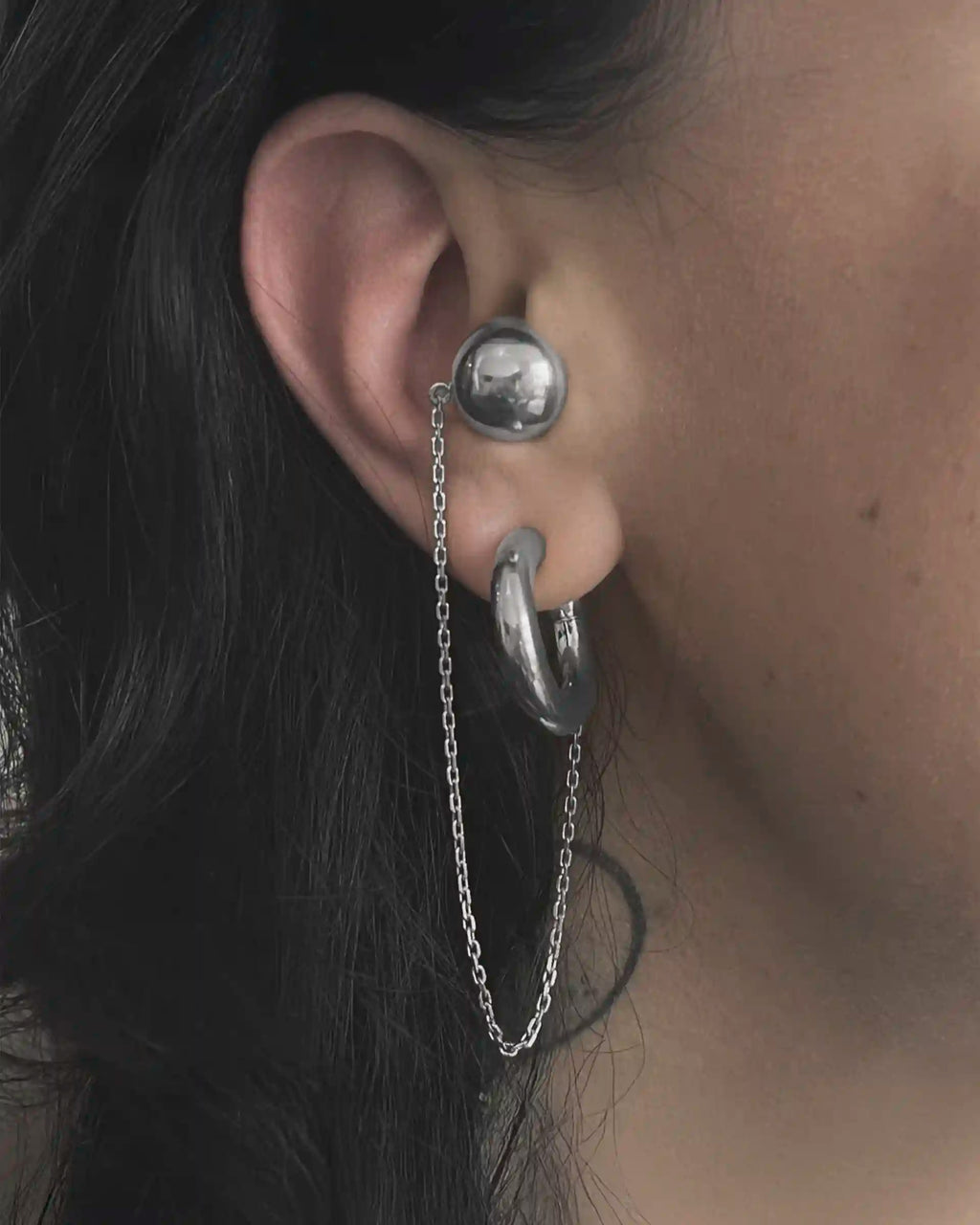 Model wearing the Alan Crocetti Mood Ear Set earring in rhodium vermeil.