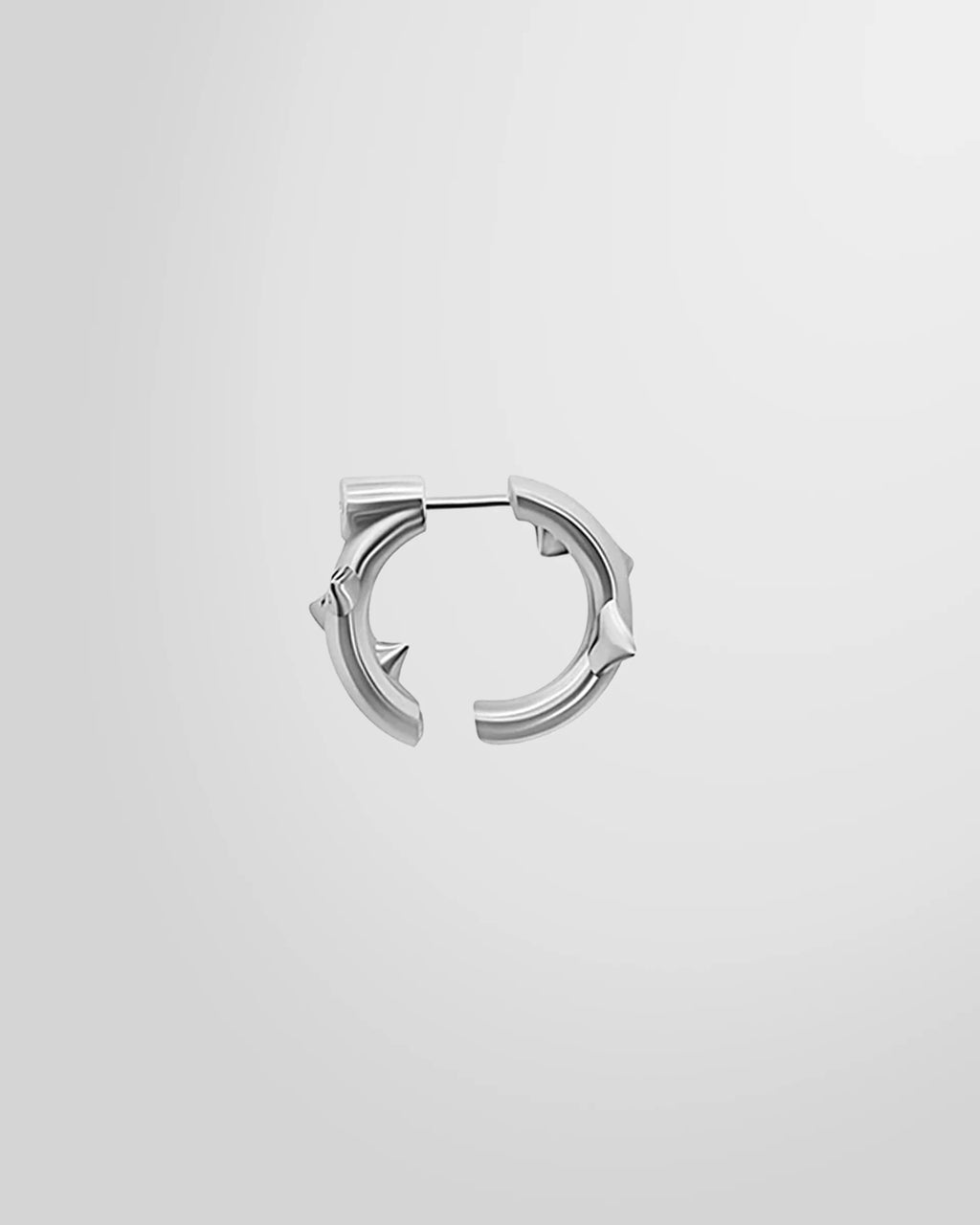 Alan Crocetti single Peekaboo Thorn Earring in rhodium-plated silver, showing open hoop and thorn detail.