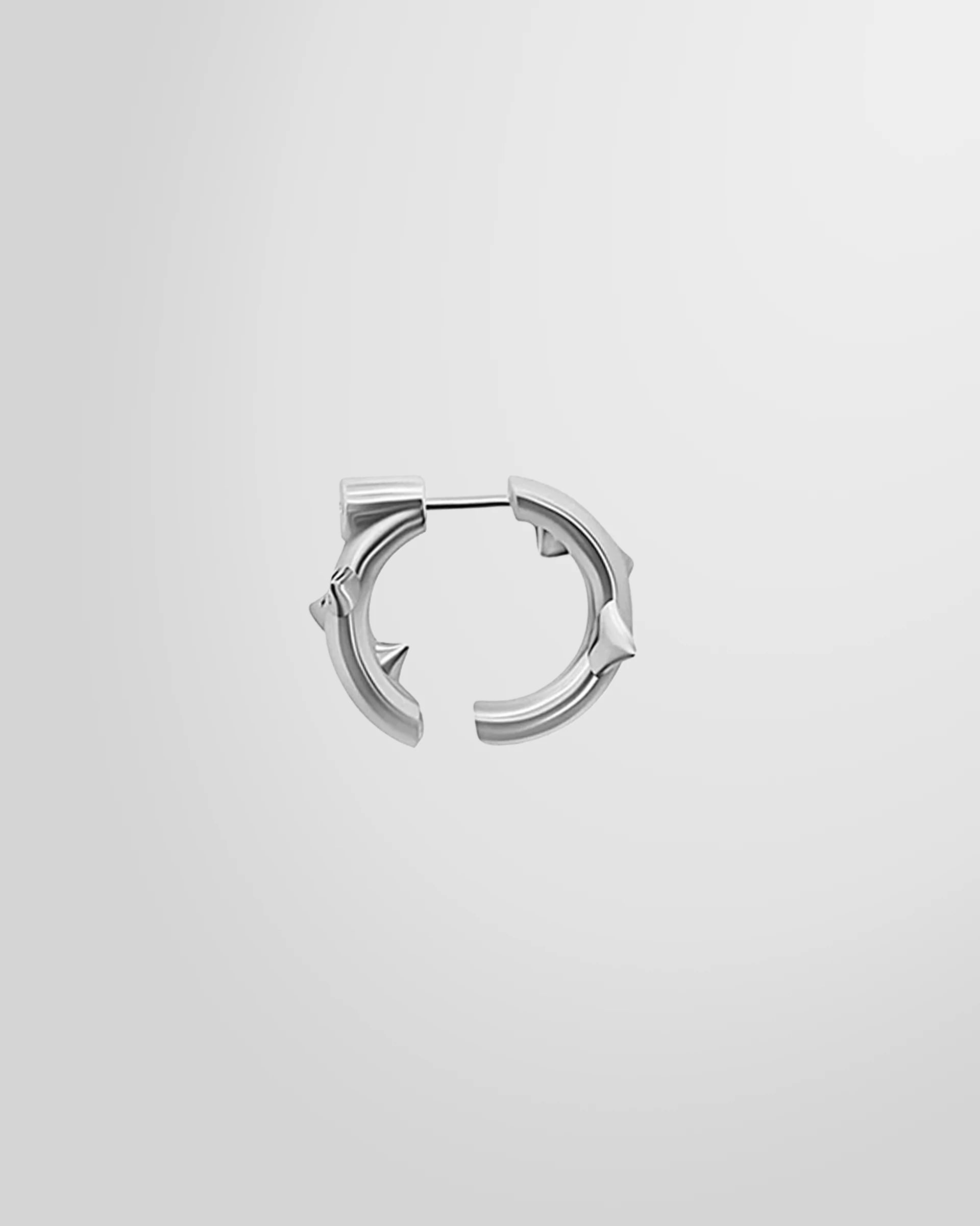 Alan Crocetti single Peekaboo Thorn Earring in rhodium-plated silver, showing open hoop and thorn detail.