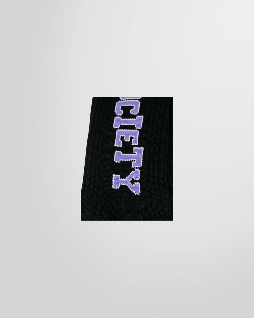 A close-up of the black Society Ribbed Socks from KTZ, featuring lilac artwork on the sides.