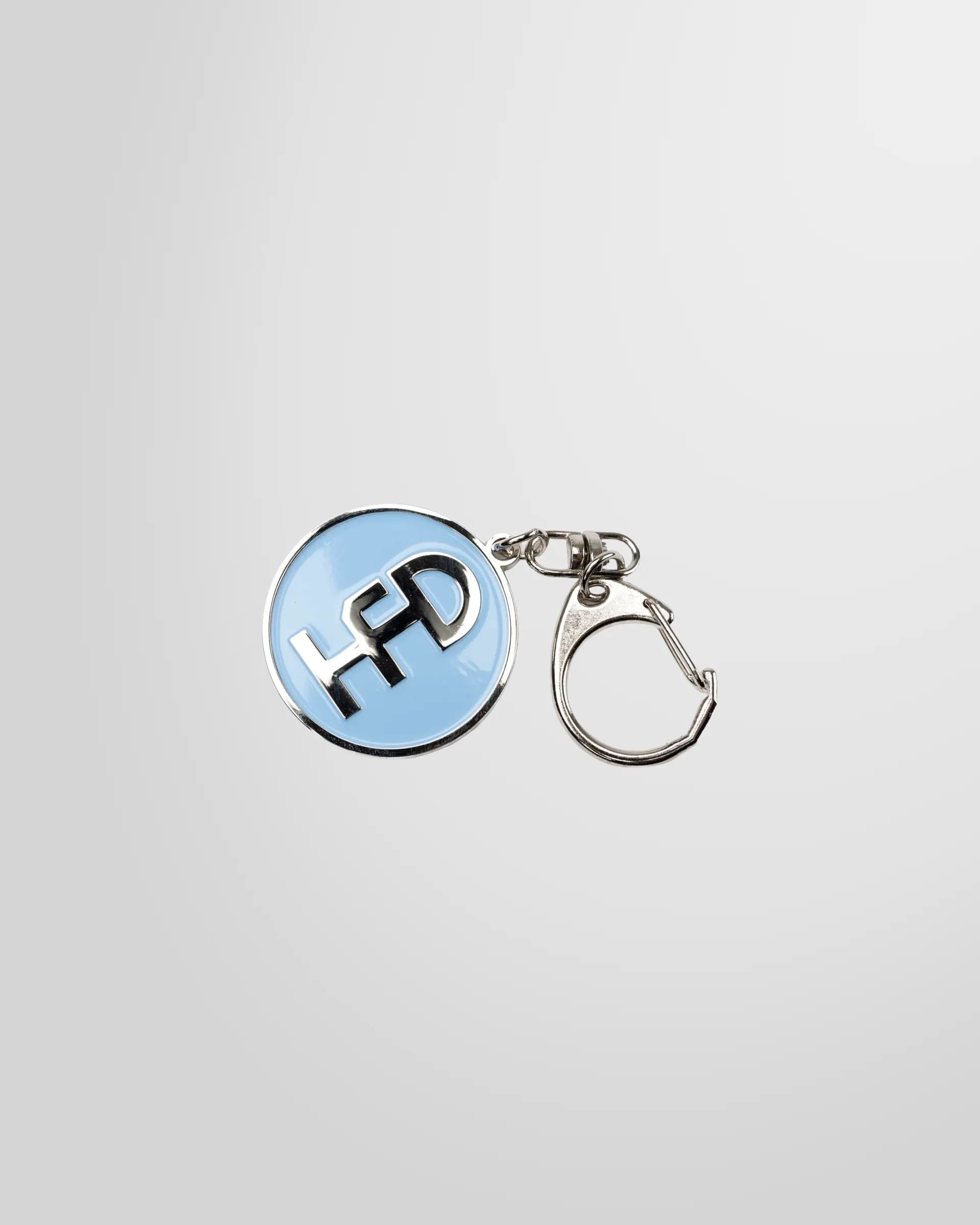 Front view of Honey Dijon Logo keyring in blue