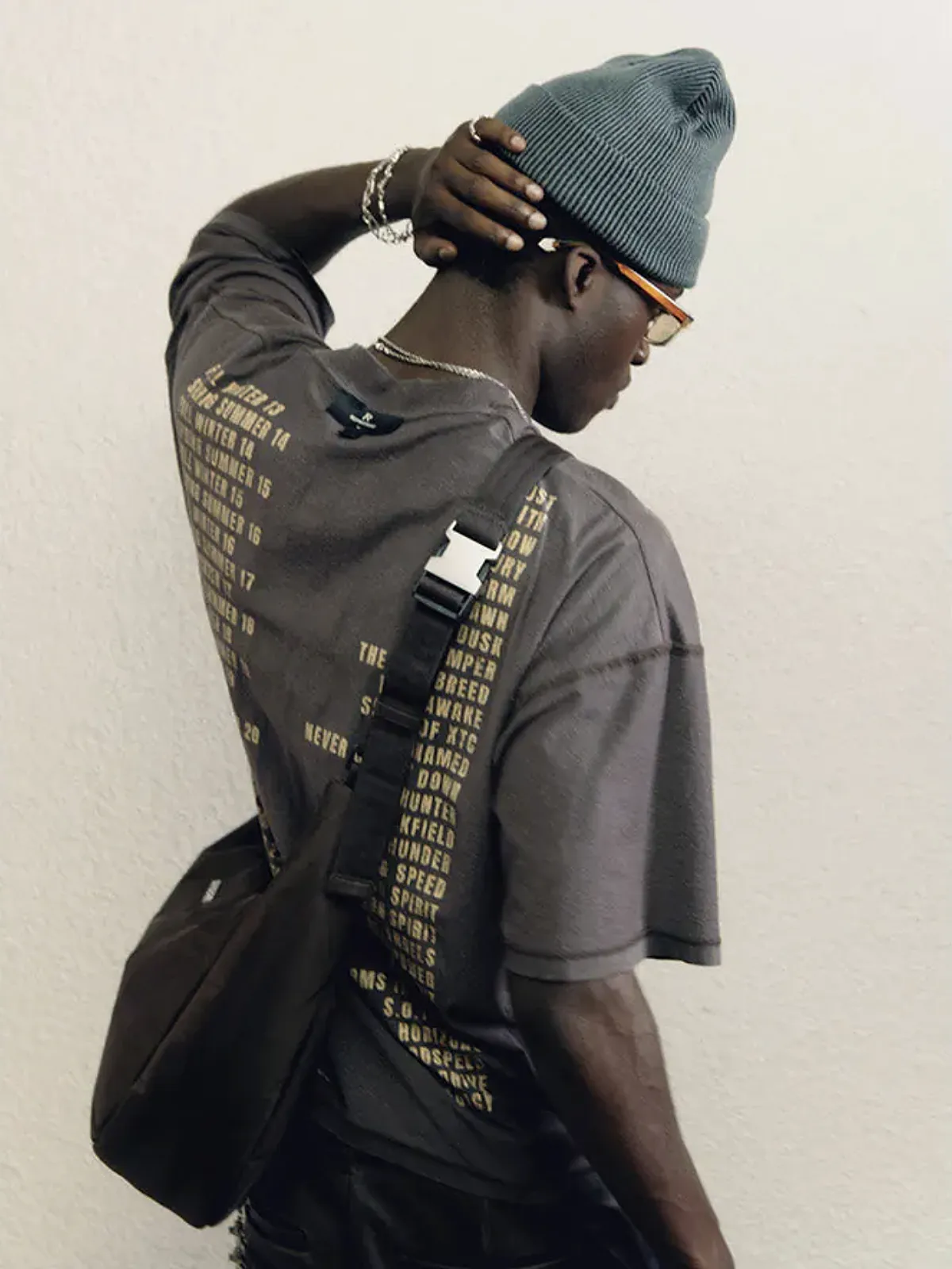 Mobile homepage banner with a model wearing Represent, link to Represent collection