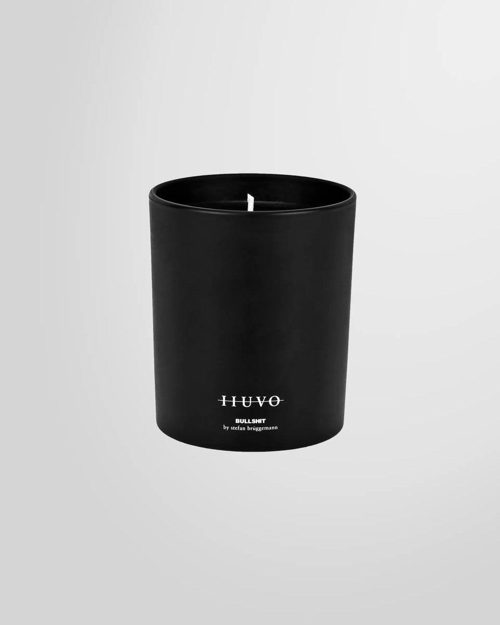 Front view of the Bullshit scented candle with label, product shot.