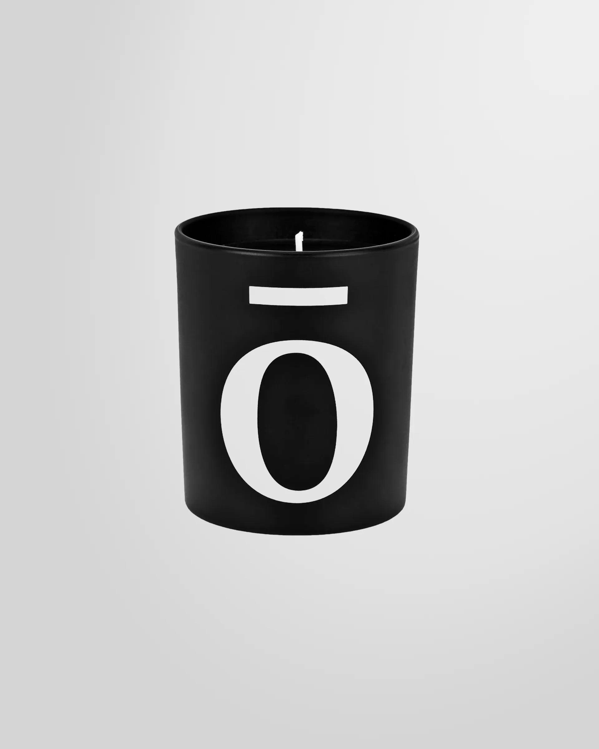 Front view of the Bullshit logo on the candle glass.