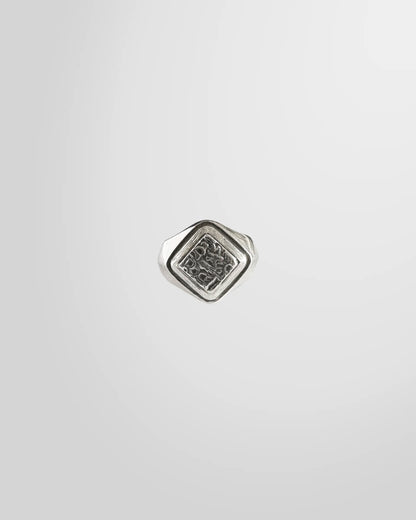 Top view of the Johnny Ramli Carved Signet Ring, showing the diamond-shaped face and intricate pattern.