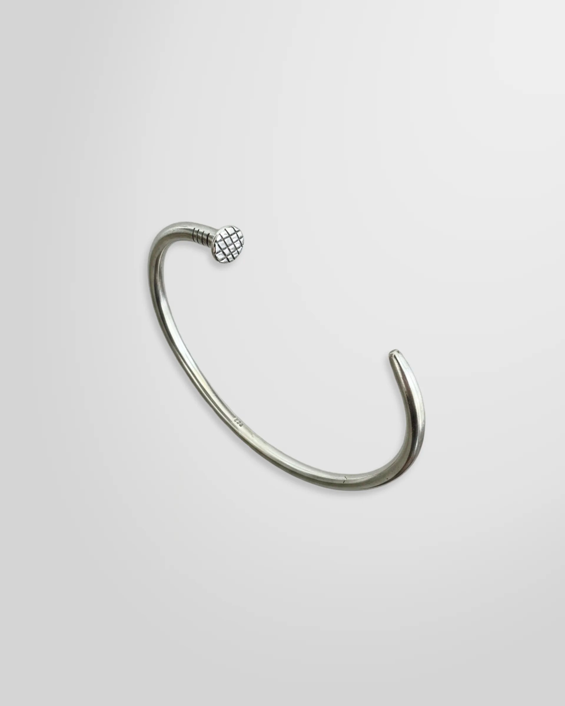Johnny Ramli Nail Cuff Sterling Silver 925 – angled view showing screw head and tapered point