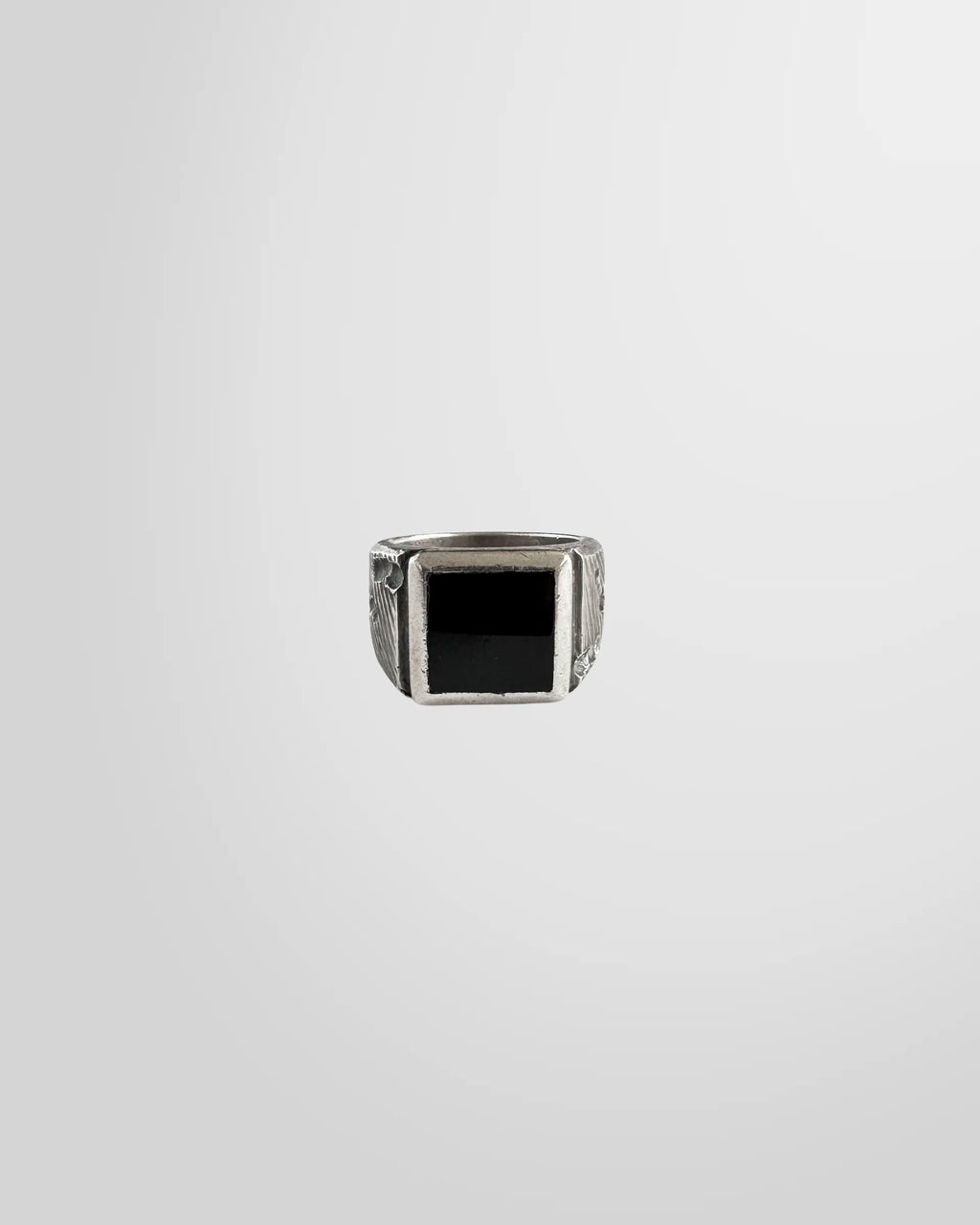 Top view of the Johnny Ramli Onyx Signet Ring, showing the sanded onyx stone.