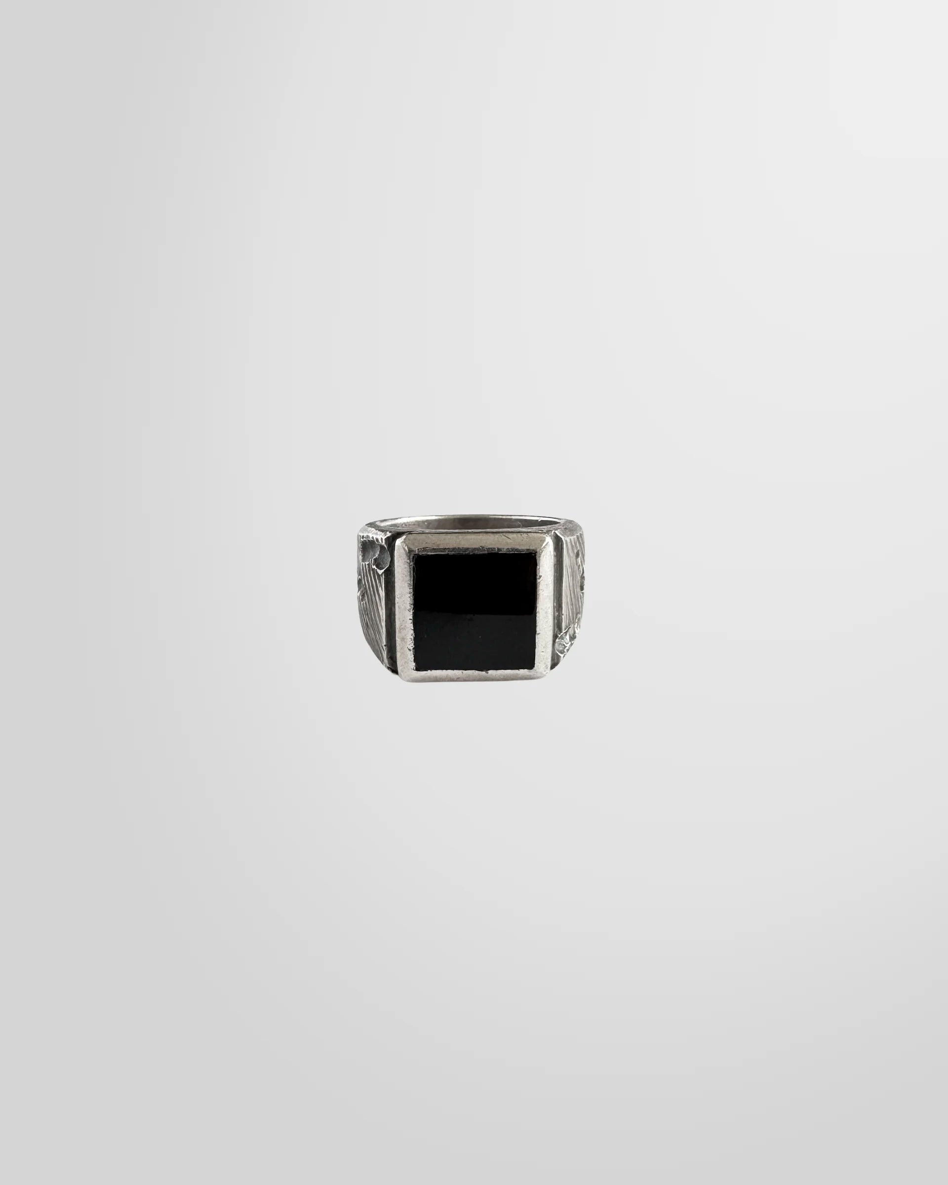 Top view of the Johnny Ramli Onyx Signet Ring, showing the sanded onyx stone.