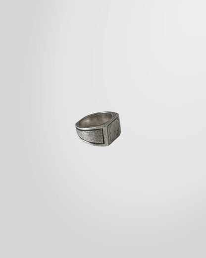 Side profile of the Johnny Ramli signet ring, highlighting the textured, oxidized finish of the silver band.