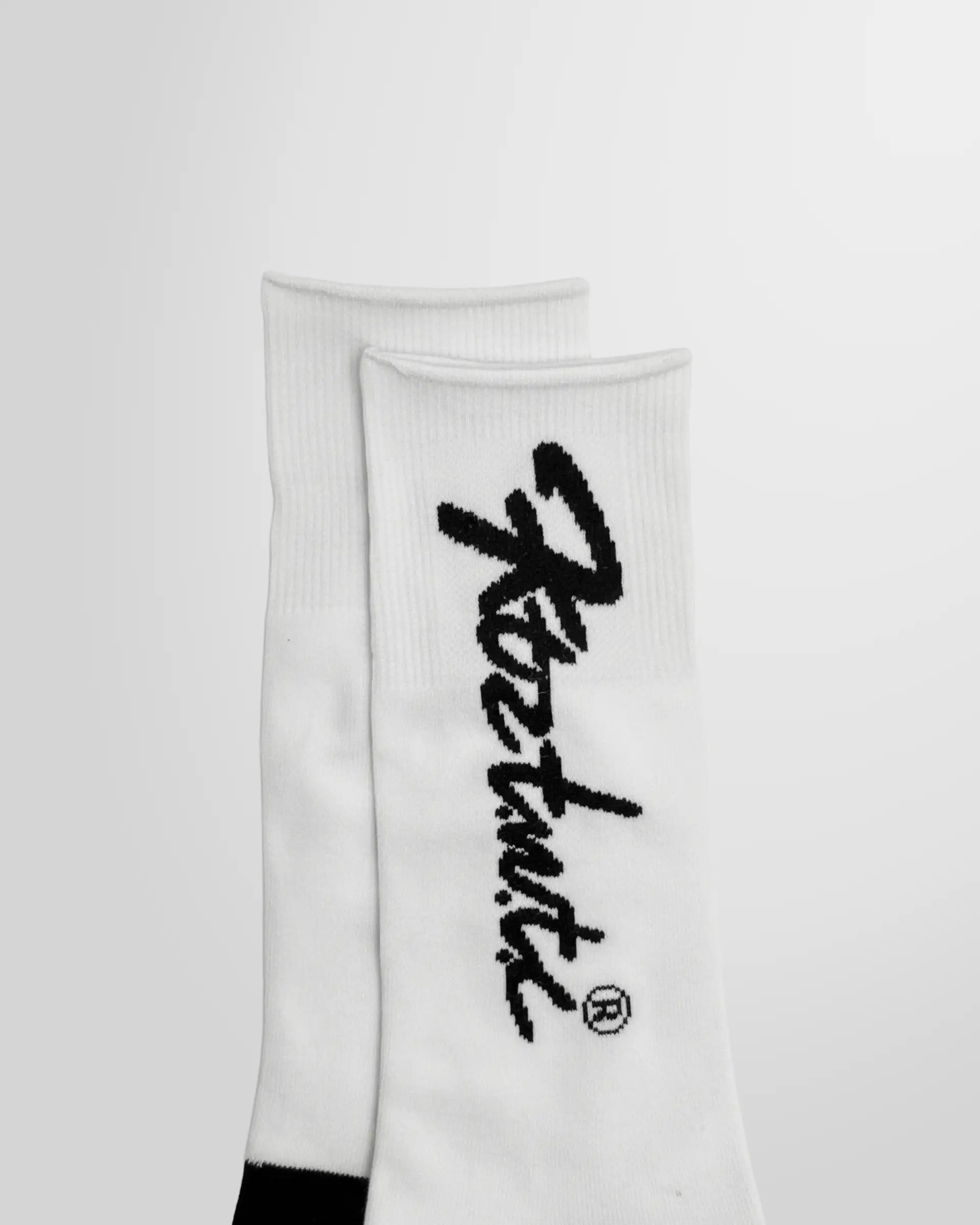 Close up view of the KTZ Logo Print Socks and the black graphic artwork