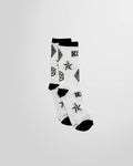 Full view of the Monogram Print Socks in white from KTZ featuring black artwork printed.