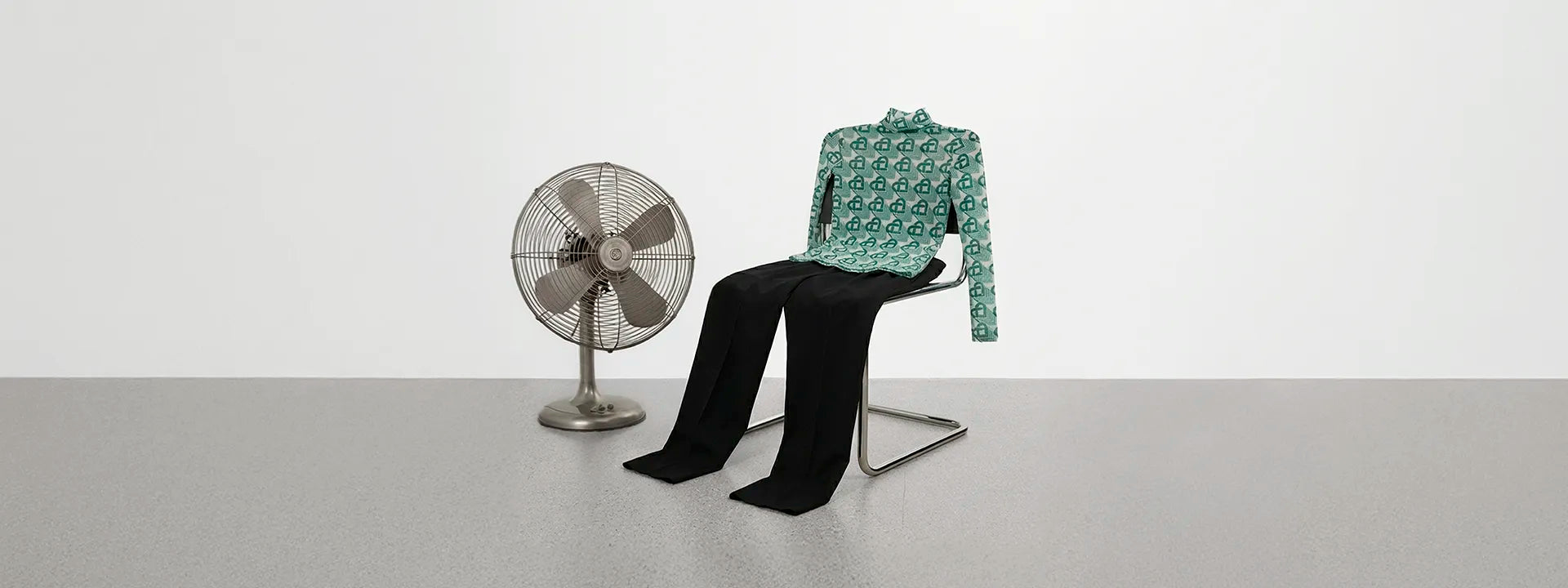 Mid-Season Sale up to 60% off hero banner desktop showing a total look from Casablanca on a chair.
