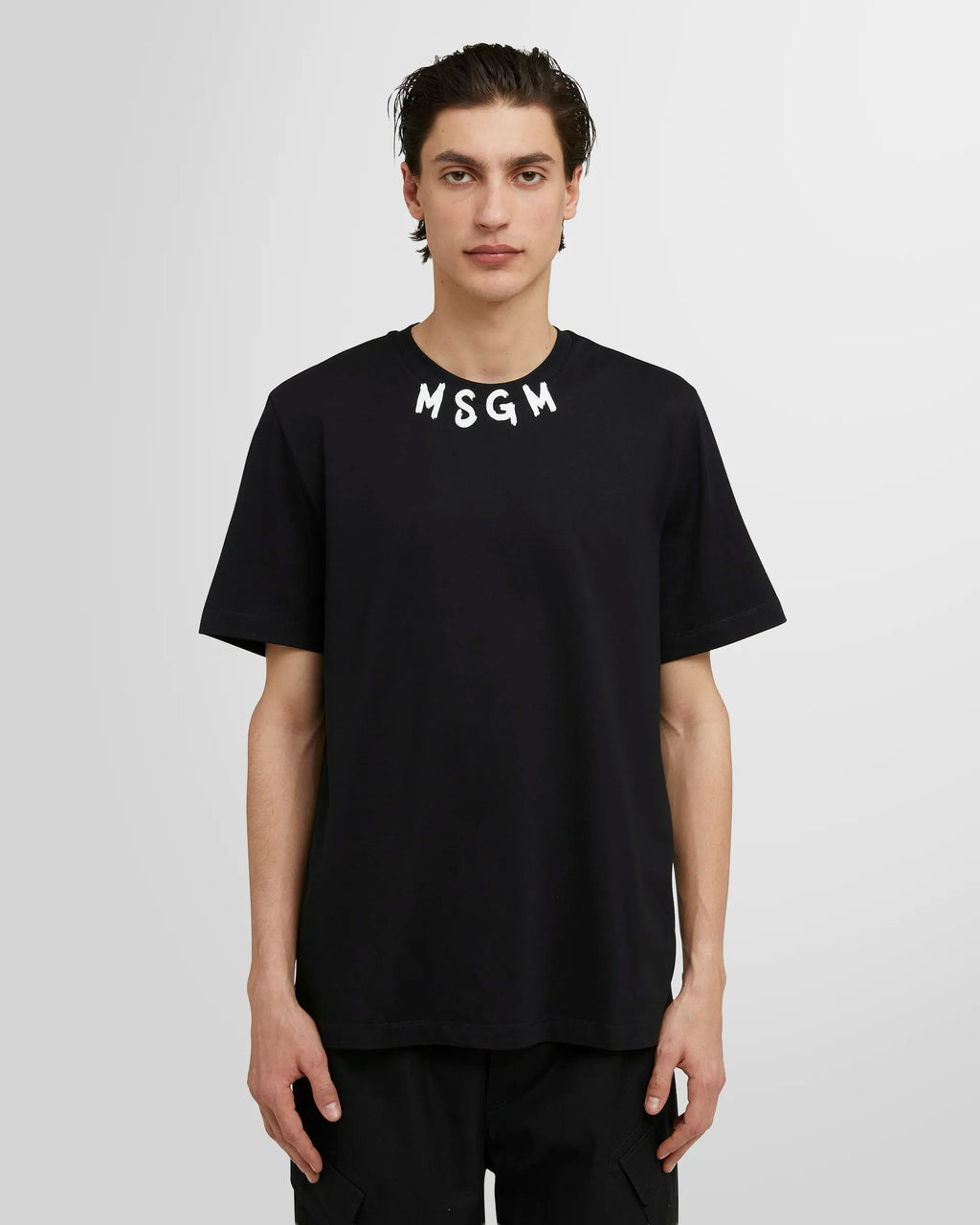 Model wearing  Msgm brushed logo t-shirt.