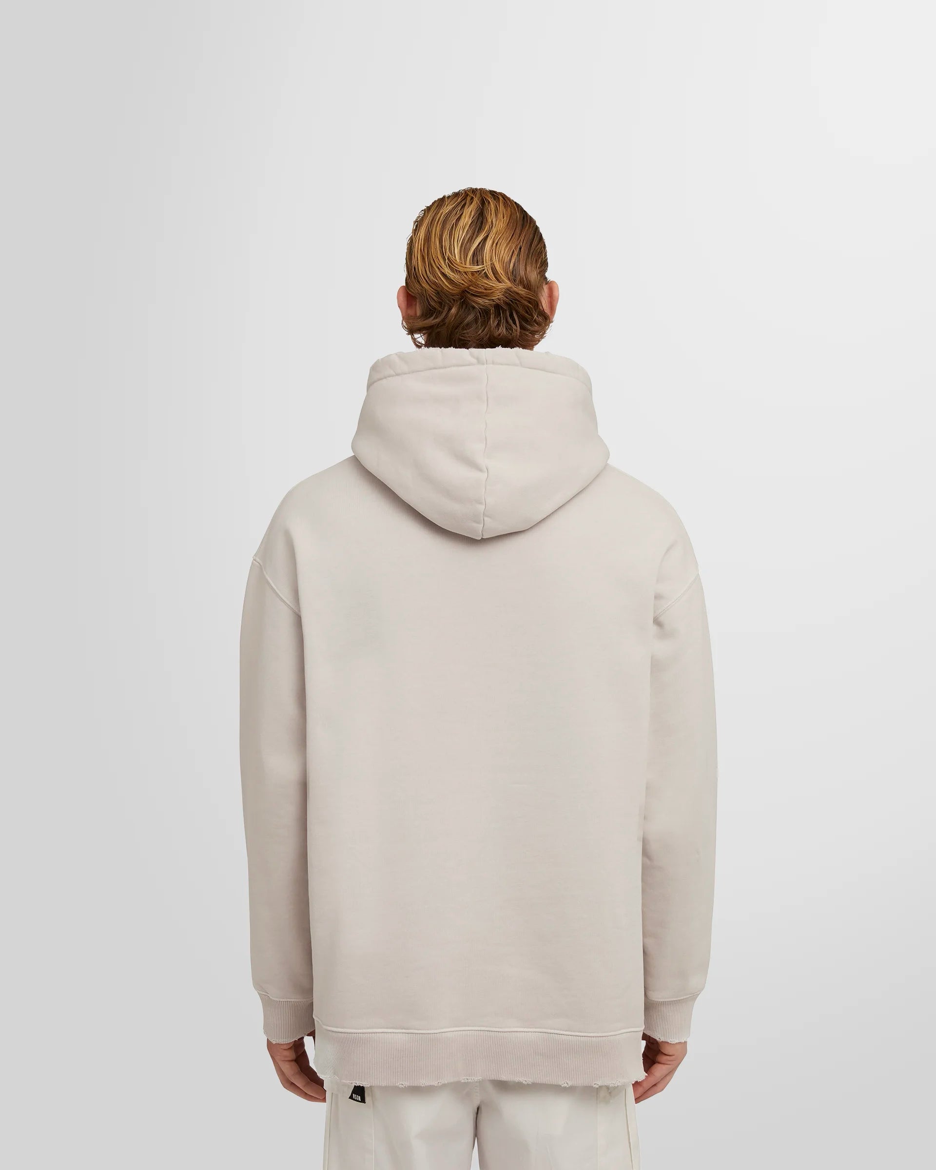 Model wearing the ash grey MSGM Distressed Logo Hoodie back view