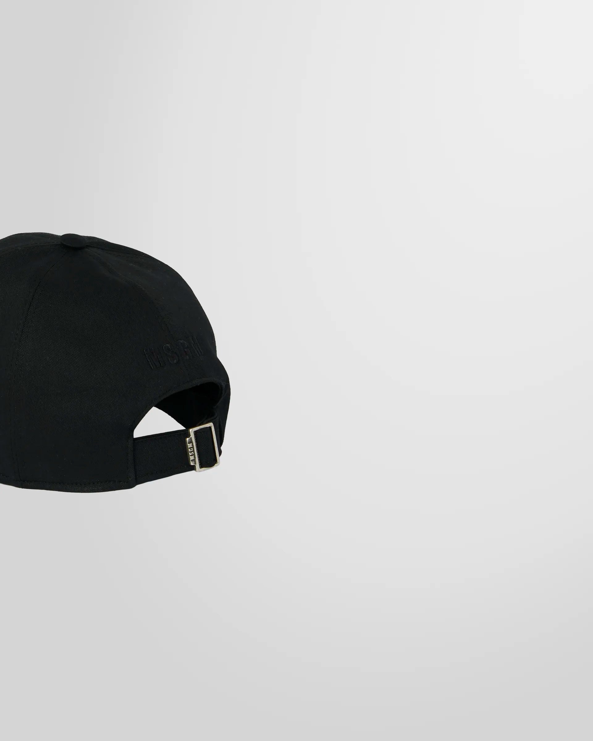 Back view of the MSGM cap, showing the adjustable strap closure.