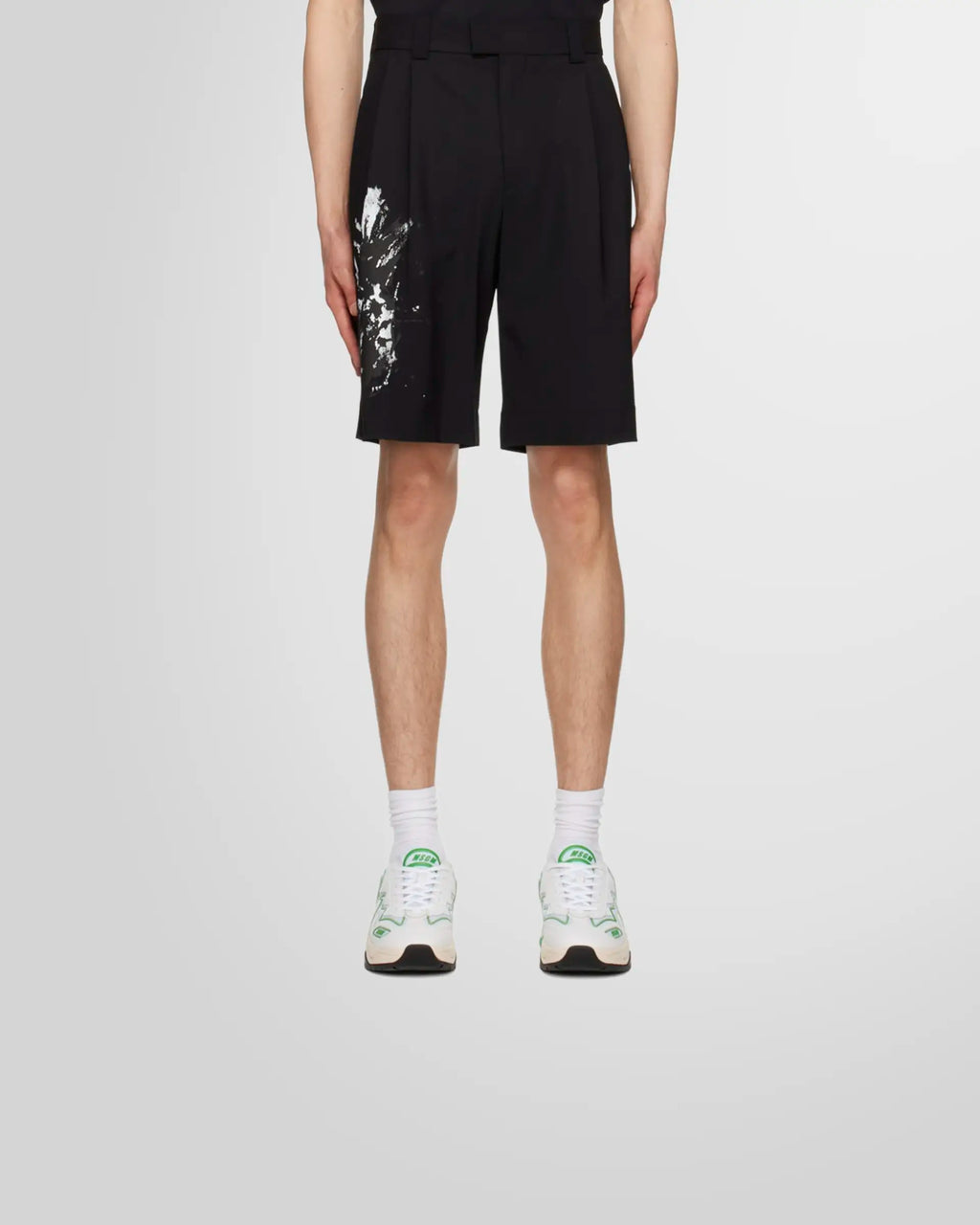 Model wearing black tailored bermuda shorts from Msgm