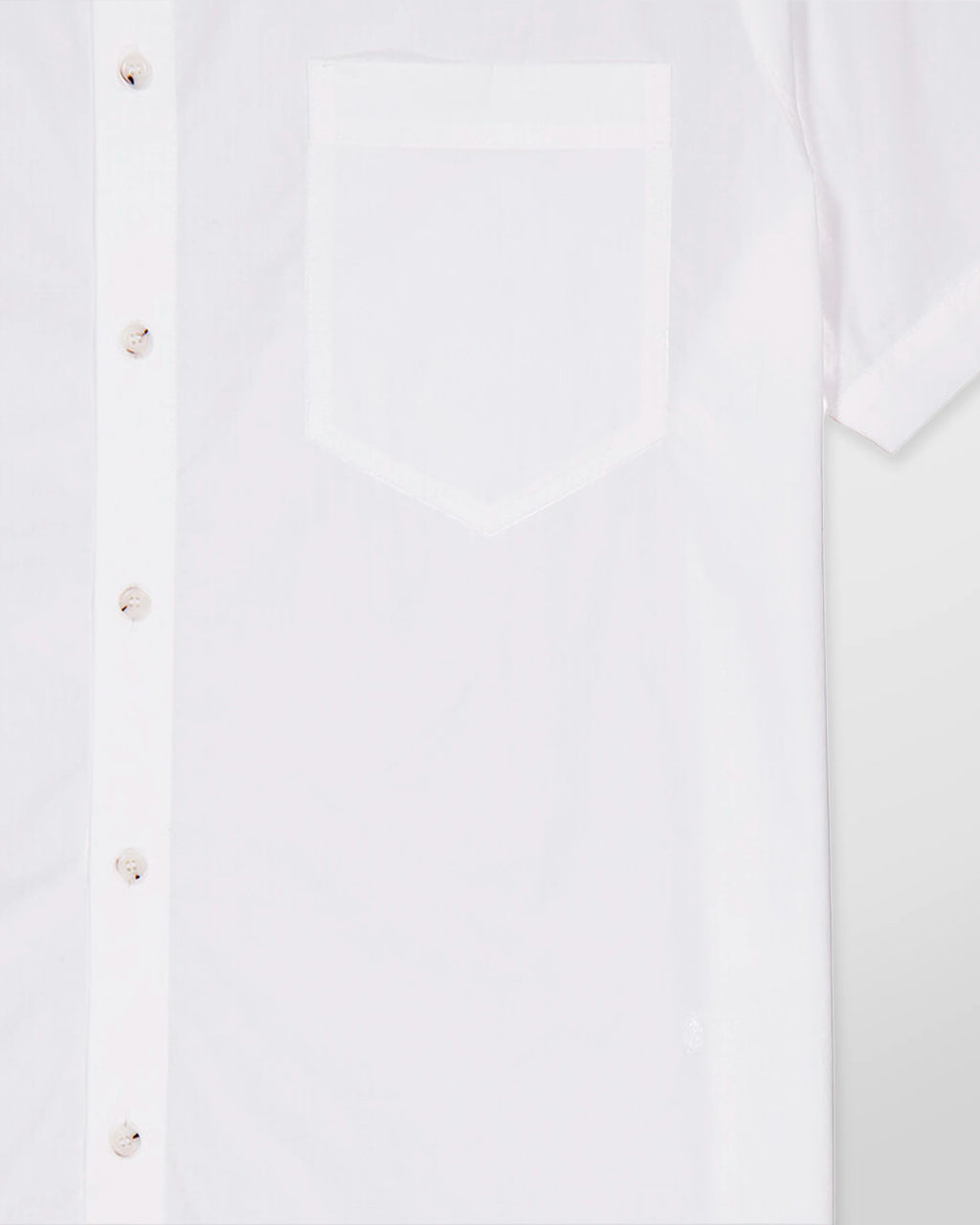 Close-up of the chest pocket with embroidered Nanushka logo on the Adam short sleeve shirt.