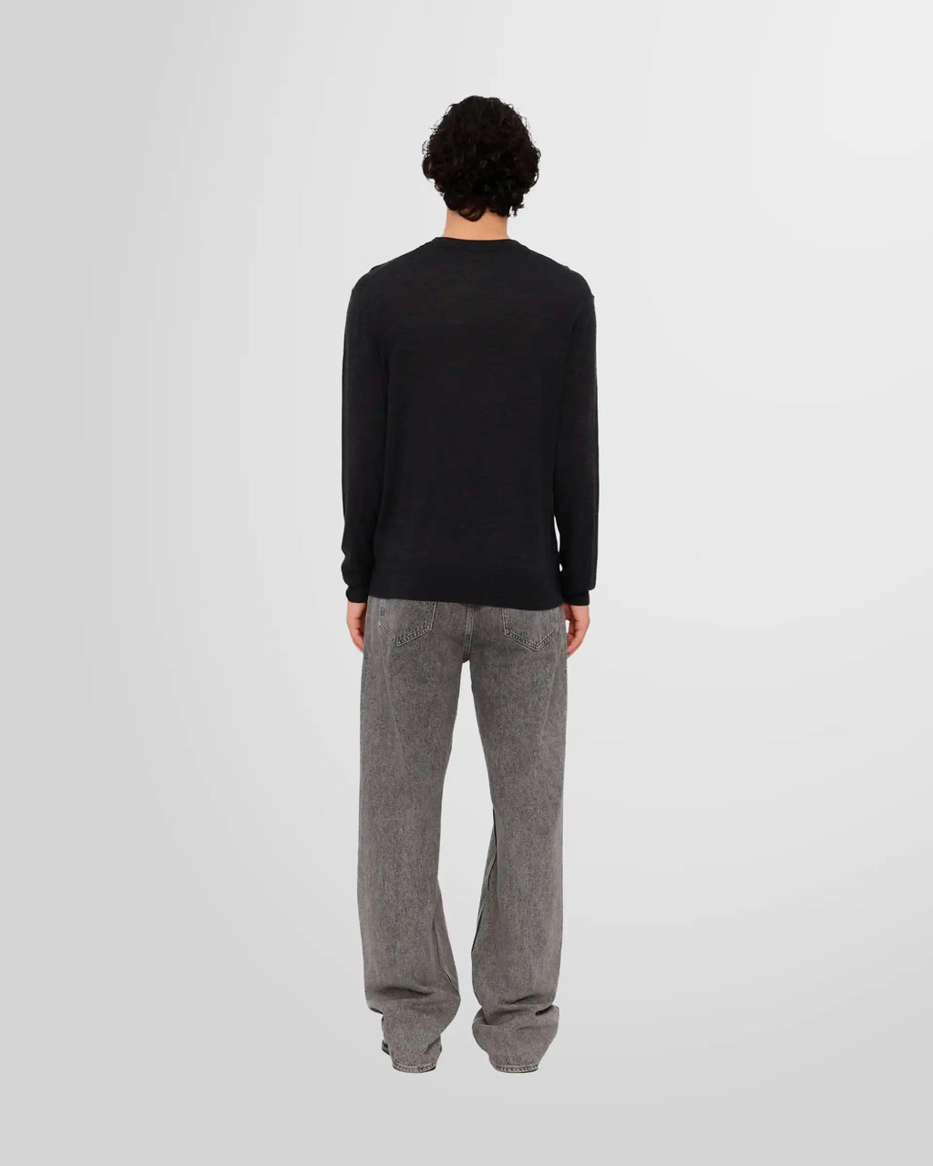 Back view of a model wearing the Nanushka Madan Fine Merino Sweater