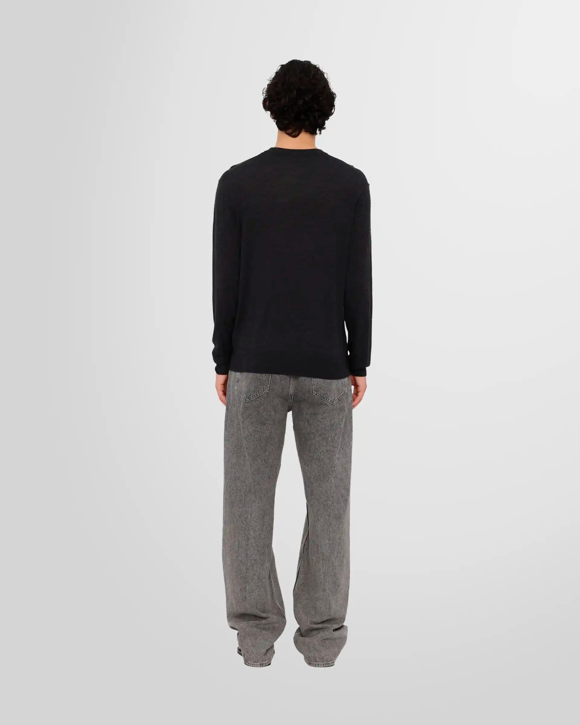 Back view of a model wearing the Nanushka Madan Fine Merino Sweater