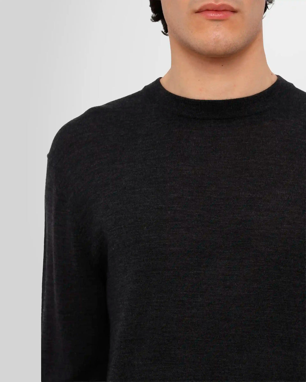 Close-up view of a model wearing the Nanushka Madan Fine Merino Sweater