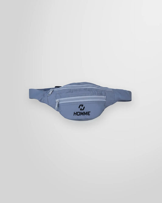 Front view of the Not Guilty Homme technical belt bag in grey, showing the external zip pockets and logo.