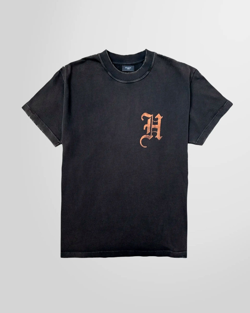 Front view of the distressed black acid‑wash t‑shirt by Not Guilty Homme.