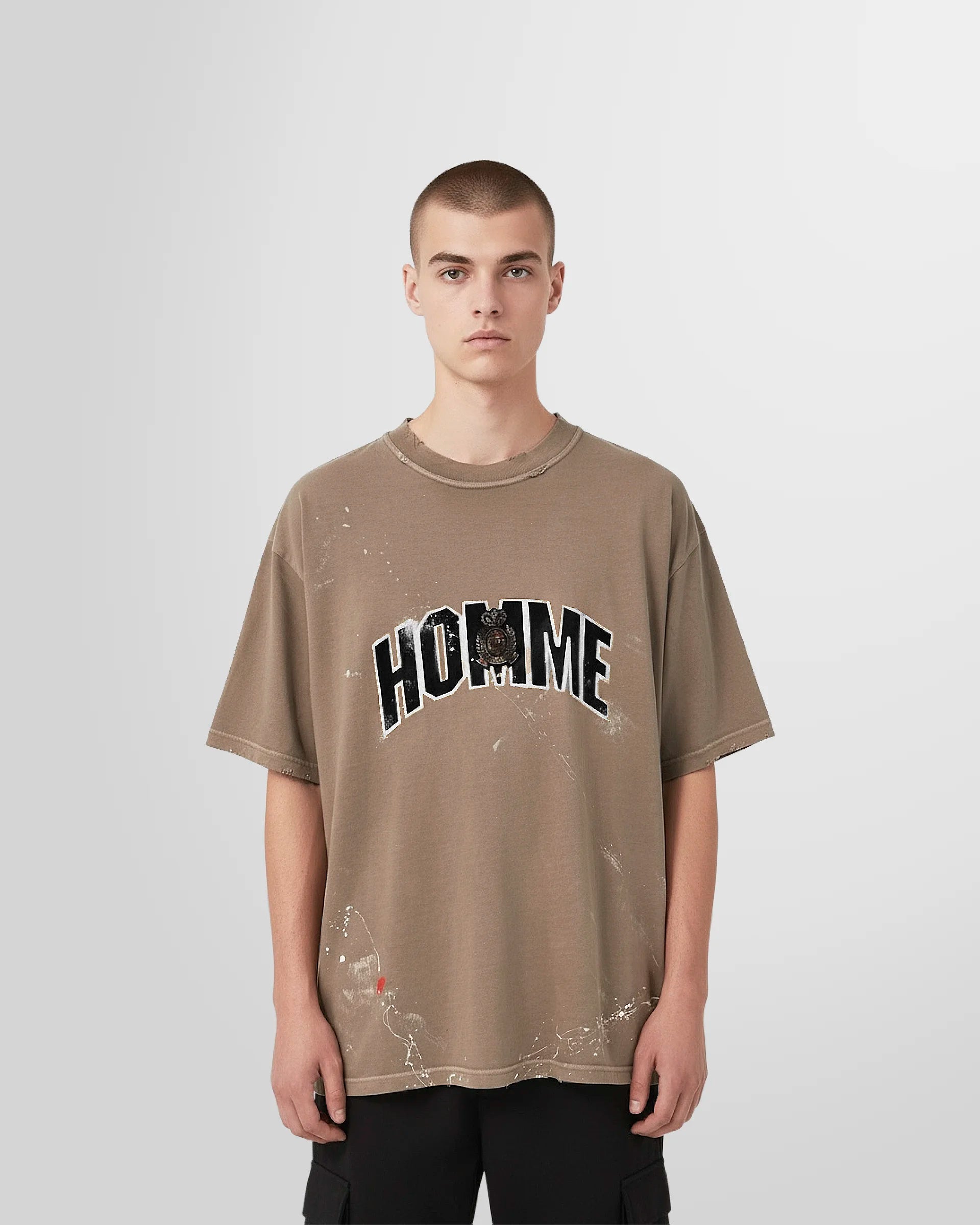 Front view of the Not Guilty Homme College T‑Shirt in beige with collegiate HOMME graphic.