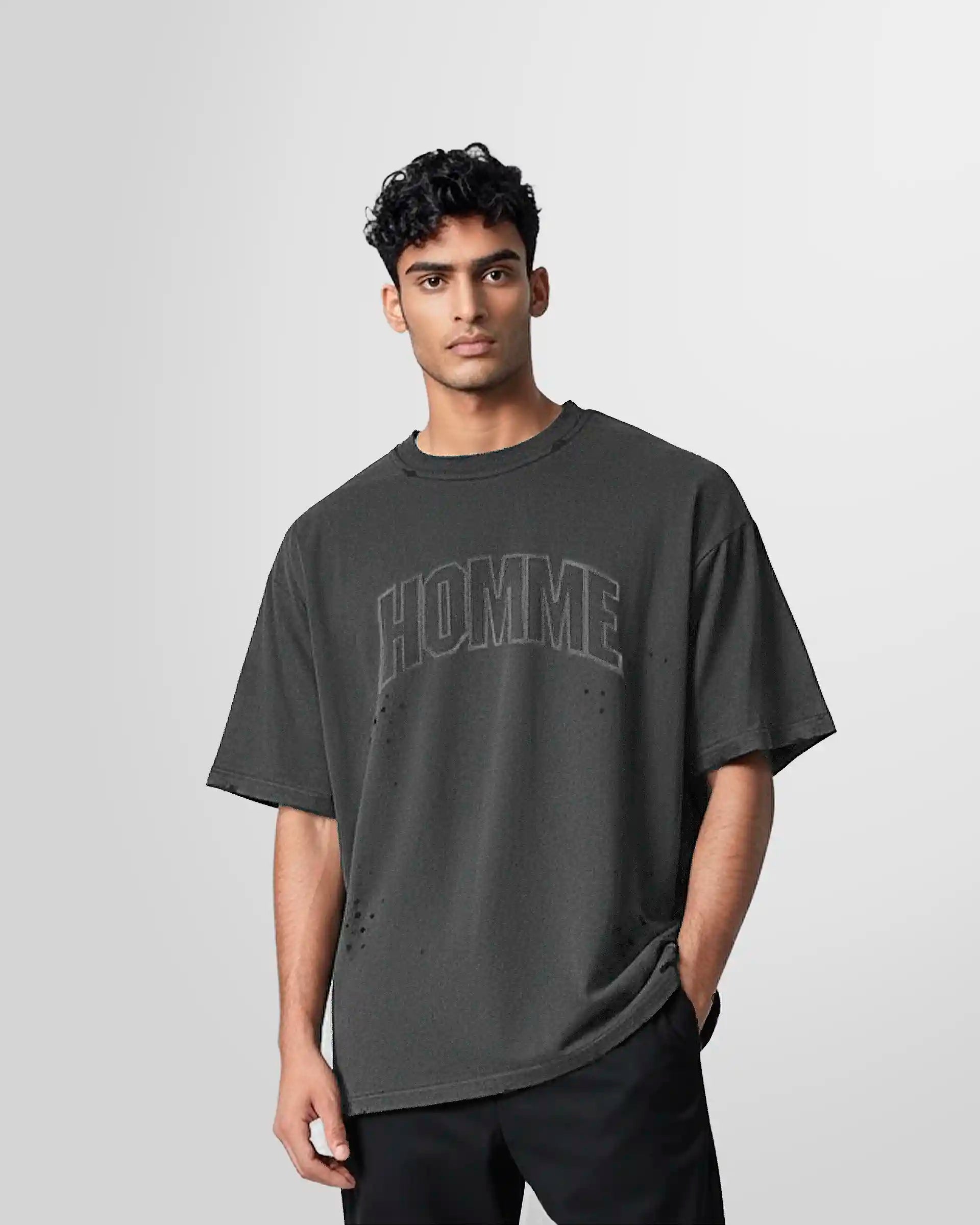 Front view of a model wearing the Not Guilty Homme College T‑Shirt in black wash with collegiate HOMME graphic.