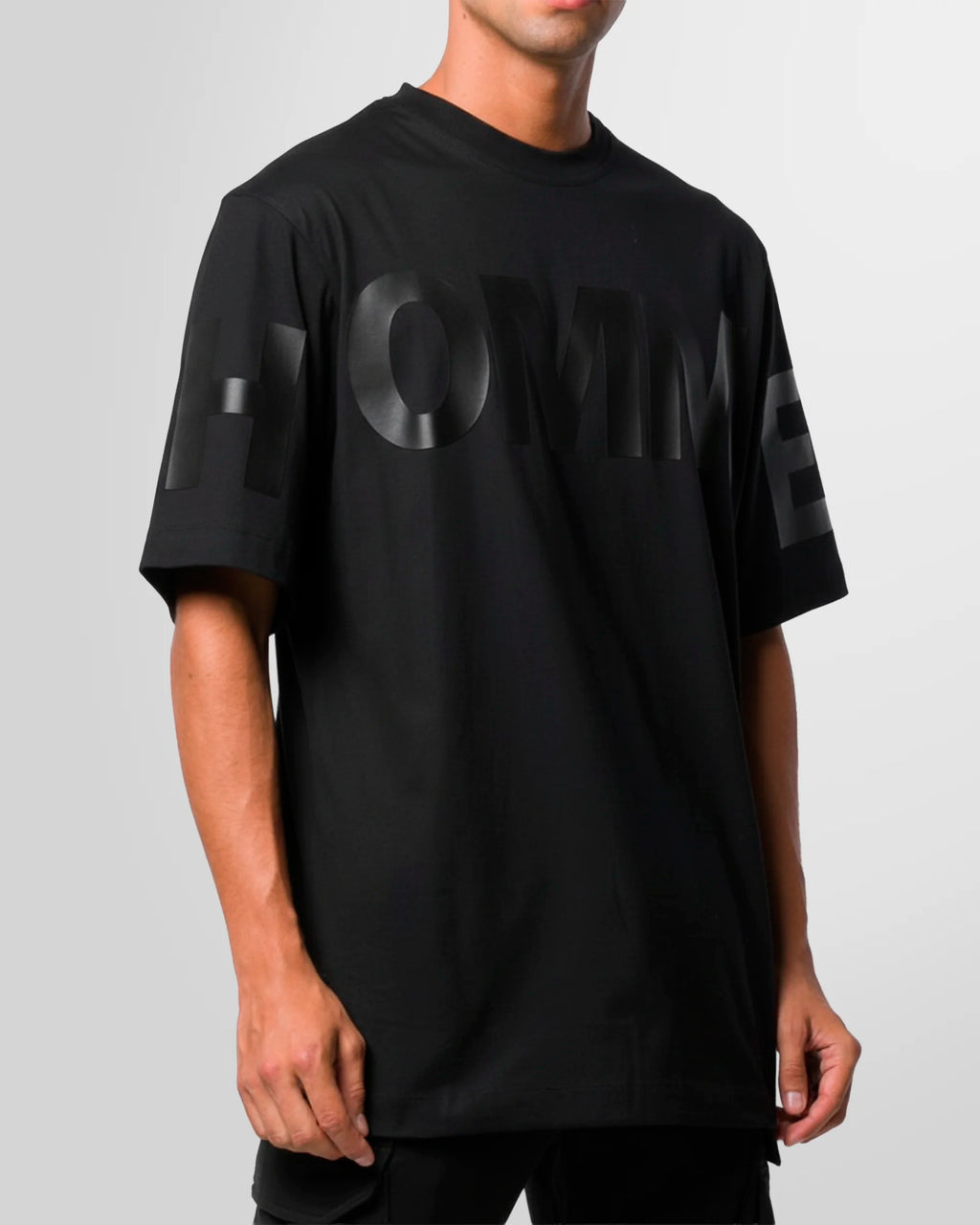 Model styled in the Not Guilty Homme graphic t-shirt, demonstrating its versatility within a contemporary fashion context.