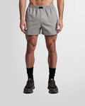 Front view of a model wearing the Not Guilty Homme Grey Boxer Swim Shorts in lightweight Nylon.