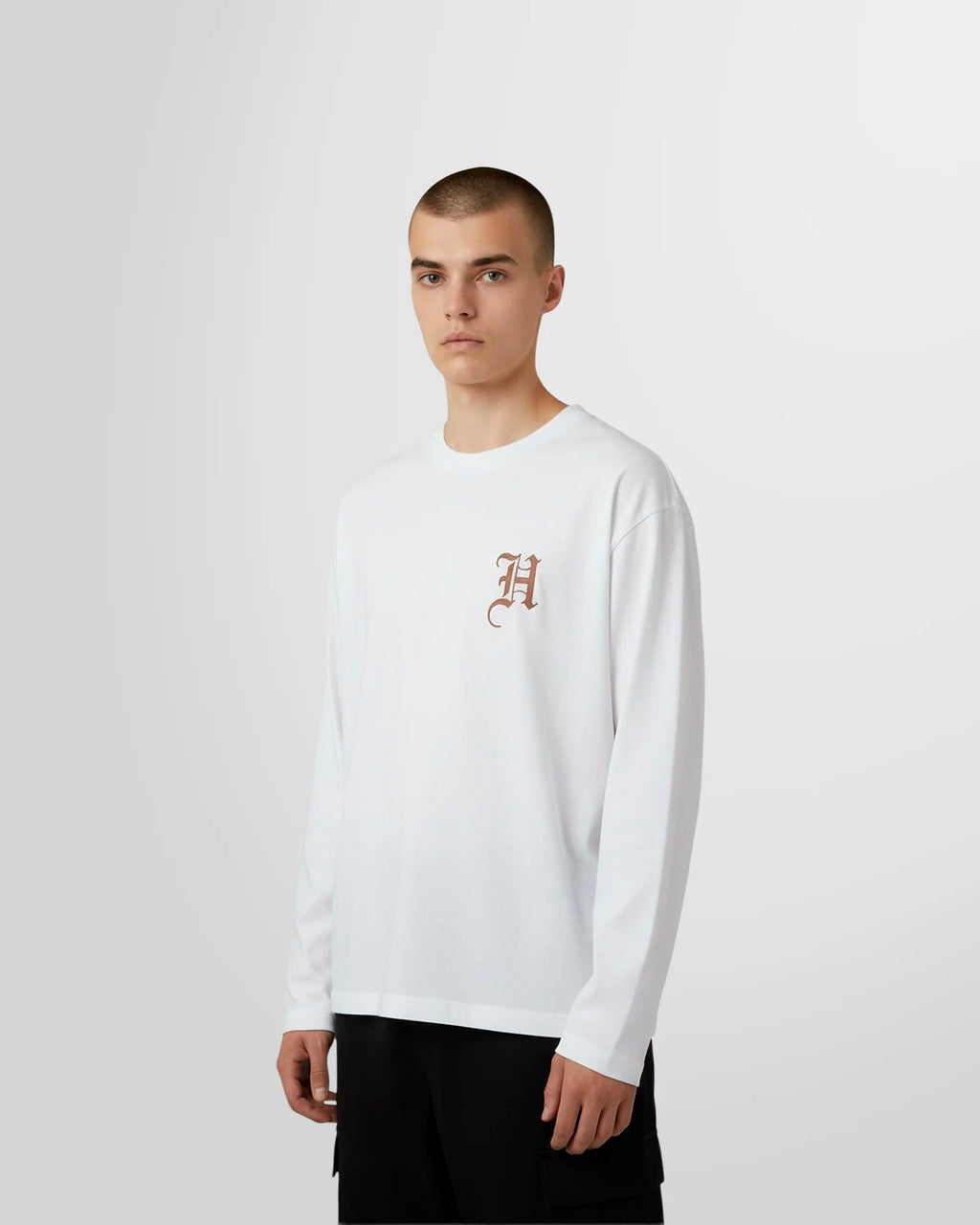 Side view of the long sleeve t‑shirt in white.