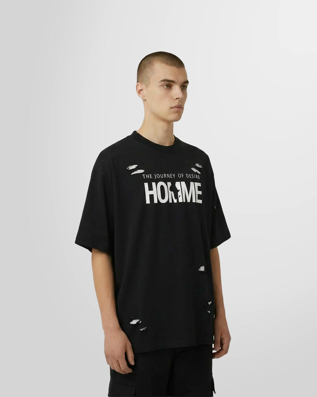 Side view of the black Journey Printed T‑Shirt with “The Journey of Desire” HOMME graphic.