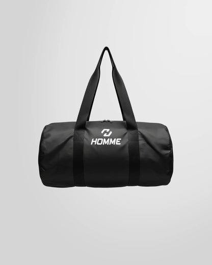 Full studio view of the Not Guilty Homme lightweight sport bag in black, showcasing its high-contrast white logo.