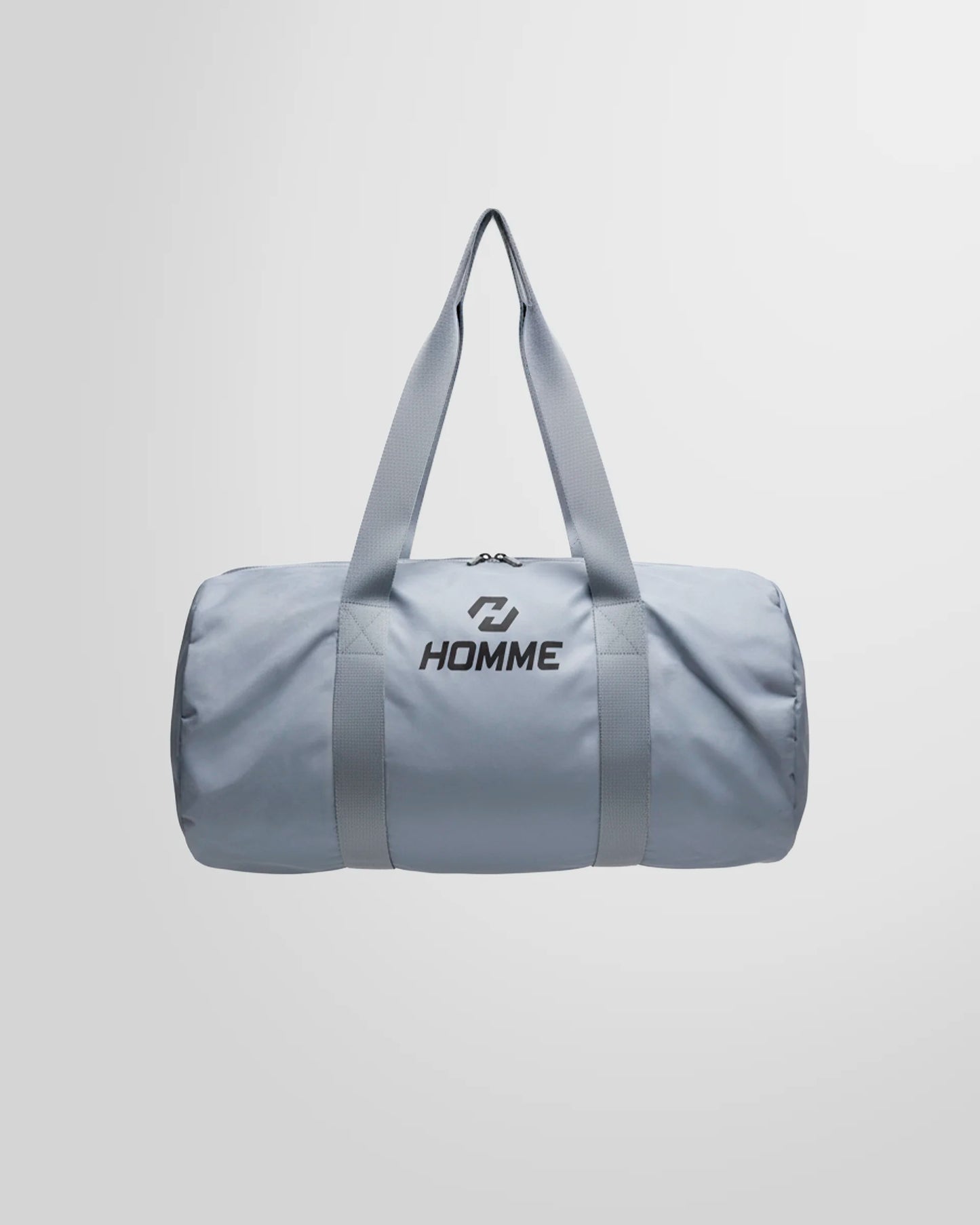 Full studio view of the Not Guilty Homme lightweight sport bag in grey, showcasing its minimalist design.