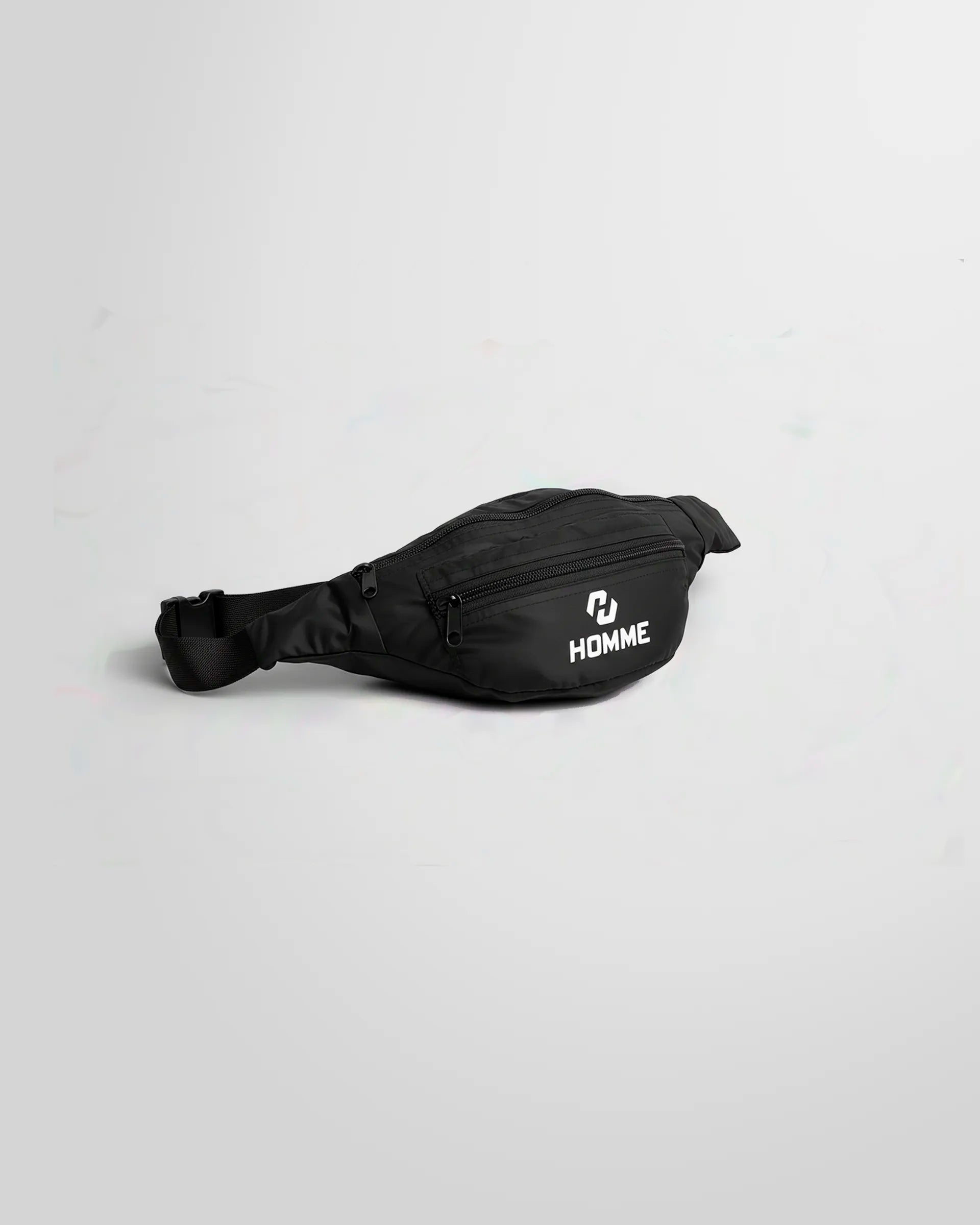 Side view of the Not Guilty Homme technical belt bag in black with whhite logo printed in the front pocket