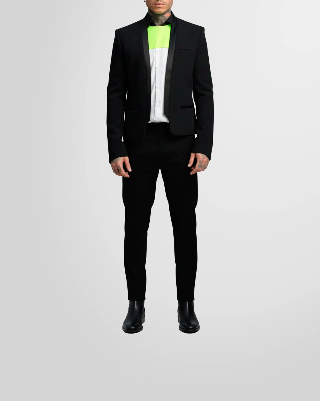 Model wearing the Not Guilty Homme blazer, showcasing its straight fit, cropped length, and open-front styling.