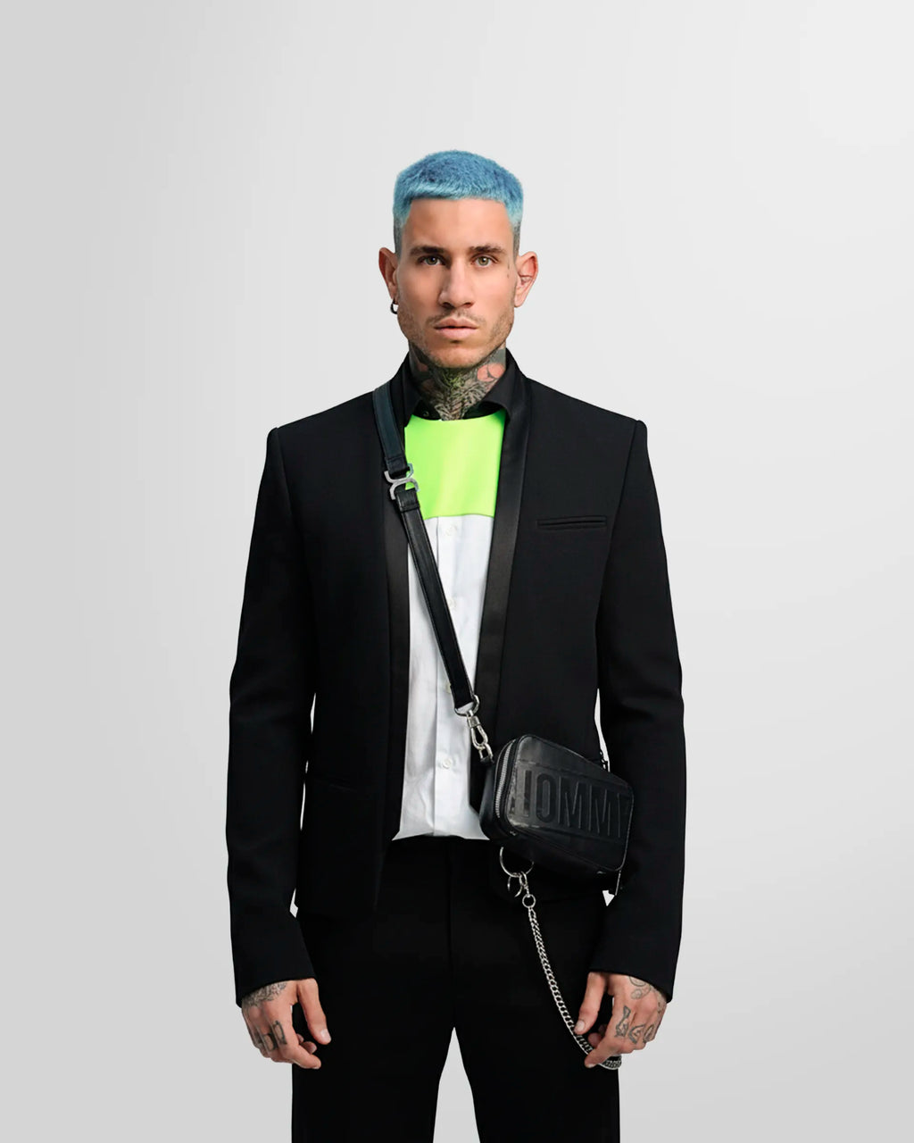 Detail shot of the blazer's straight cuff with three covered buttons as worn by a model.