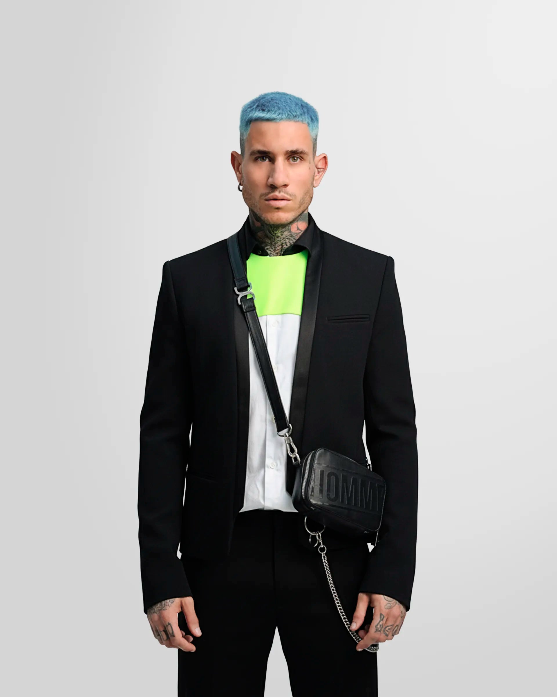 Detail shot of the blazer's straight cuff with three covered buttons as worn by a model.